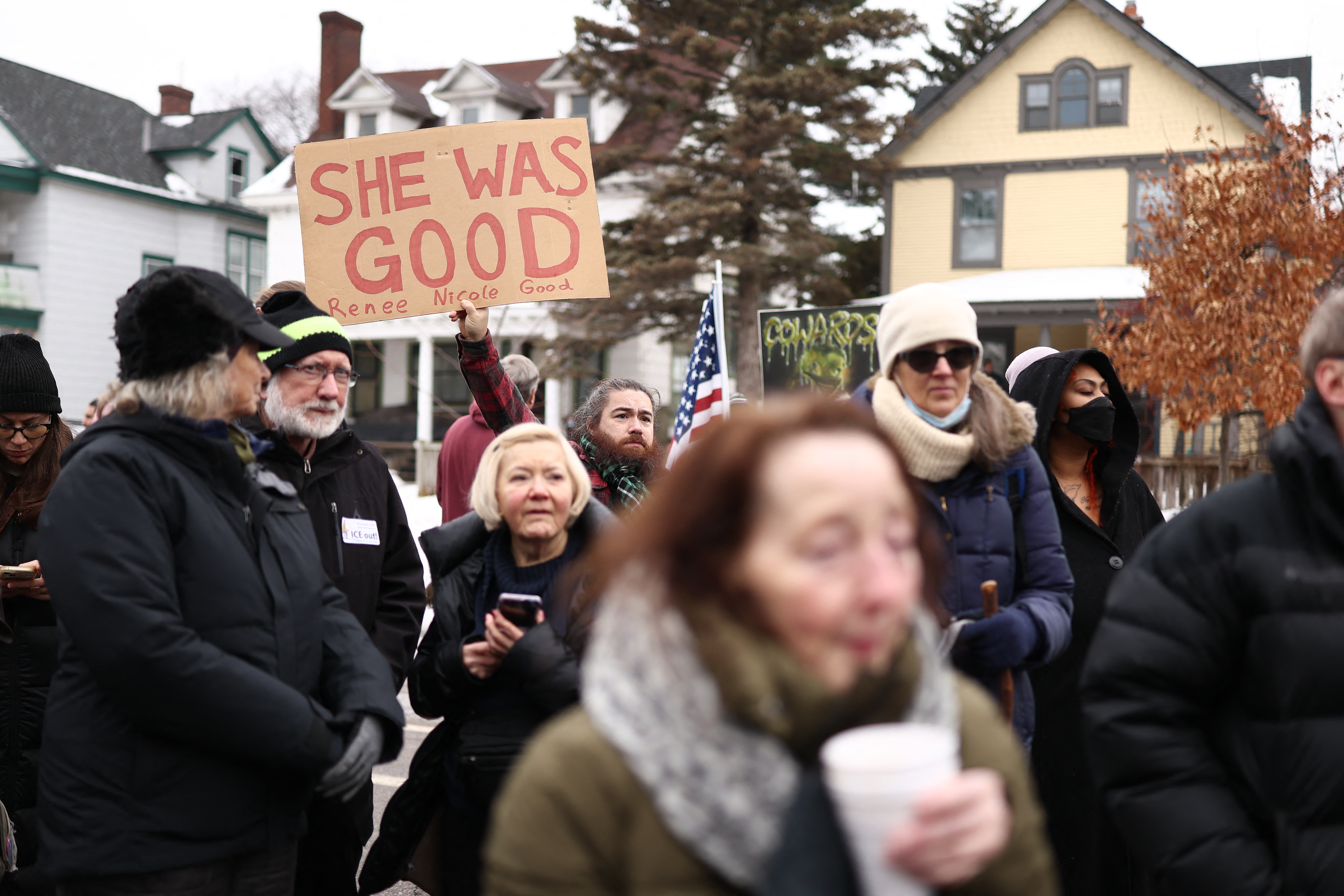 Demonstrators gather at the street where 37-year-old Renee Nicole Good was shot and killed at point blank range on January 7 by a US Immigration and Customs Enforcement (ICE) agent as she apparently tried to drive away from agents who were crowding around her car, in Minneapolis, Minnesota, on January 8, 2026.