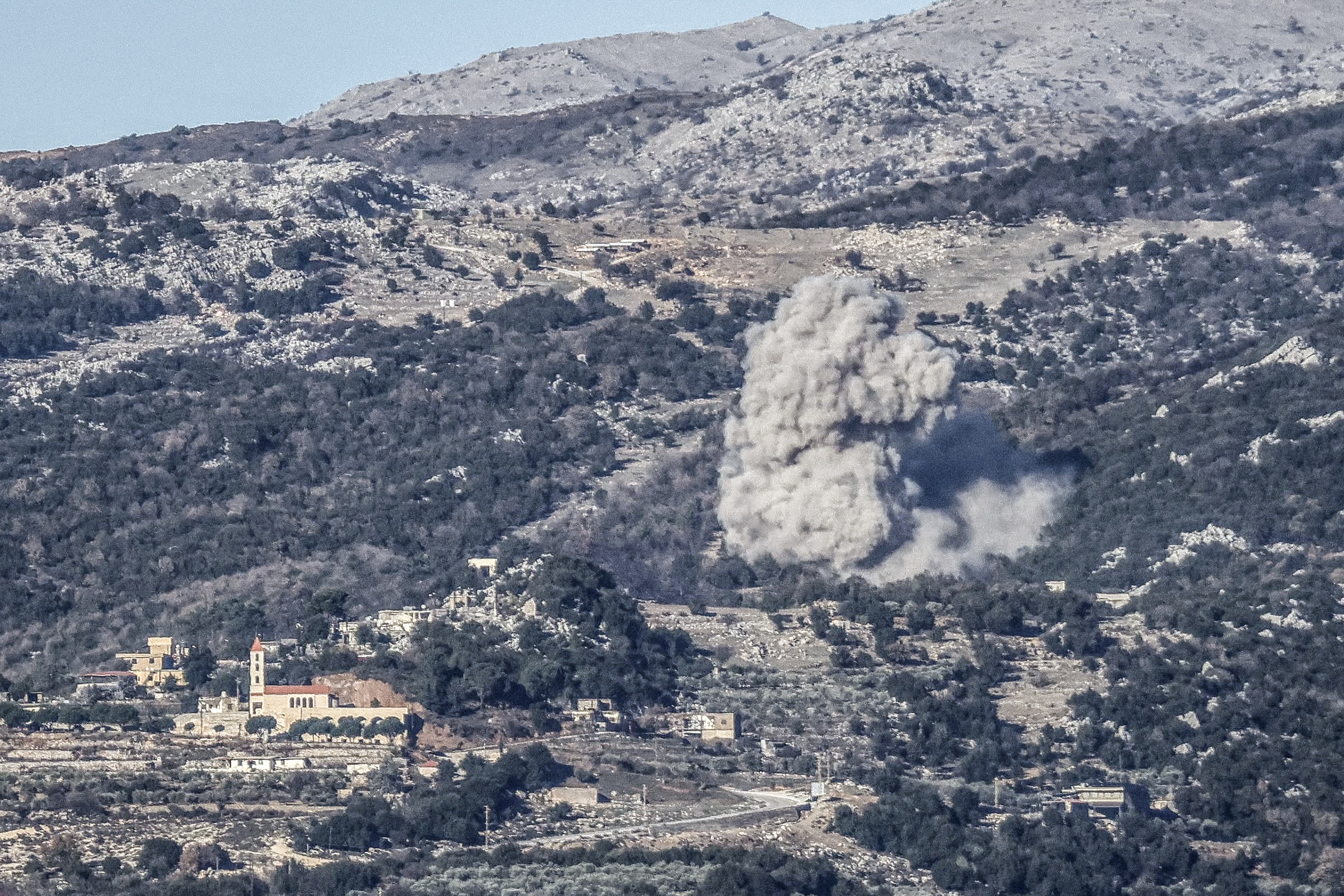 Smoke rises from the site of an Israeli airstrike that struck the hillsides near the southern Lebanese village of Al-Katrani on January 11, 2026.