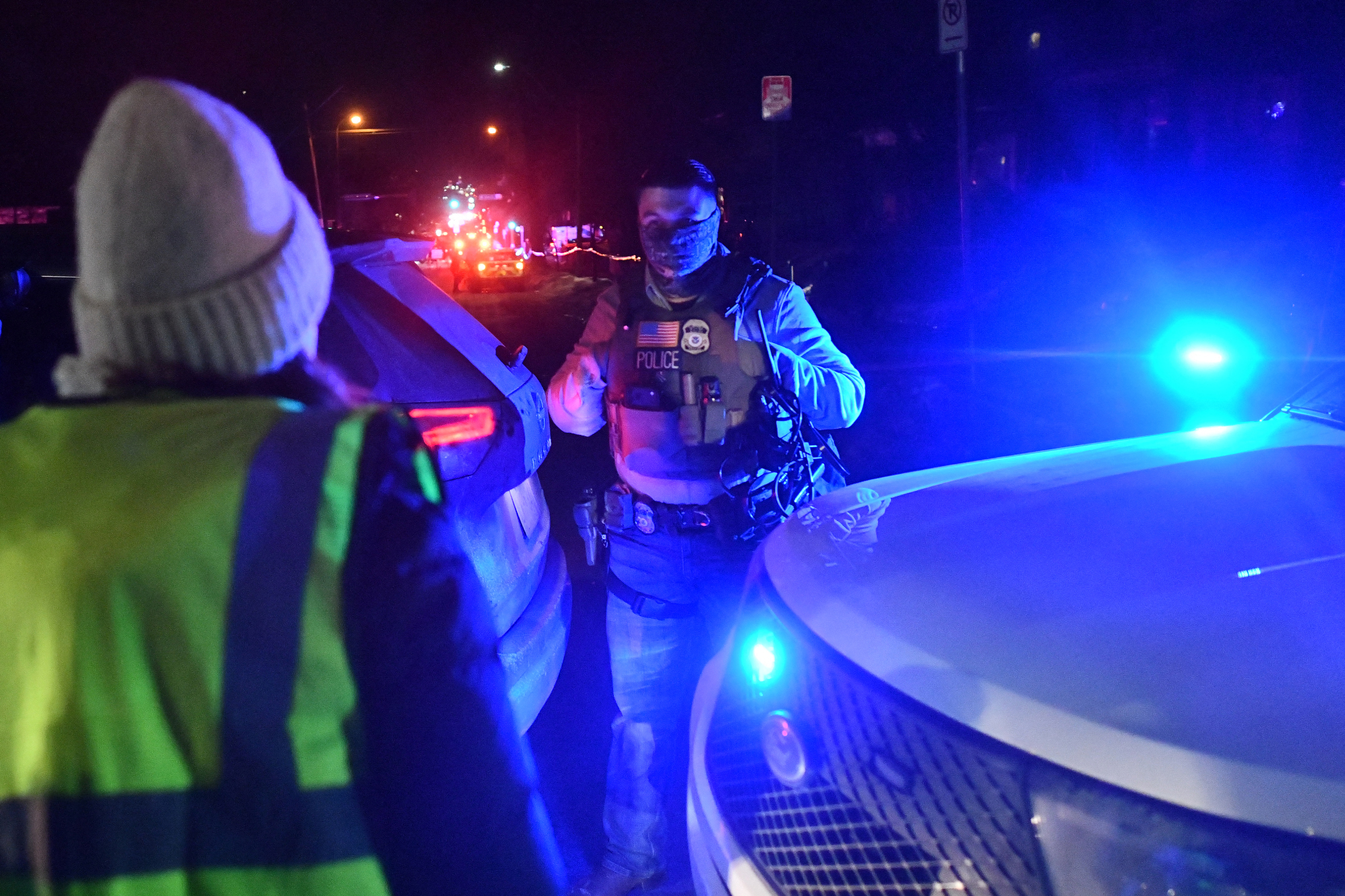 A demonstrator confronts a masked ICE agent as protests broke out following the shooting of a Venezuelan man by a Immigration and Customs Enforcement (ICE) agent in Minneapolis, Minnesota, on January 14, 2026.