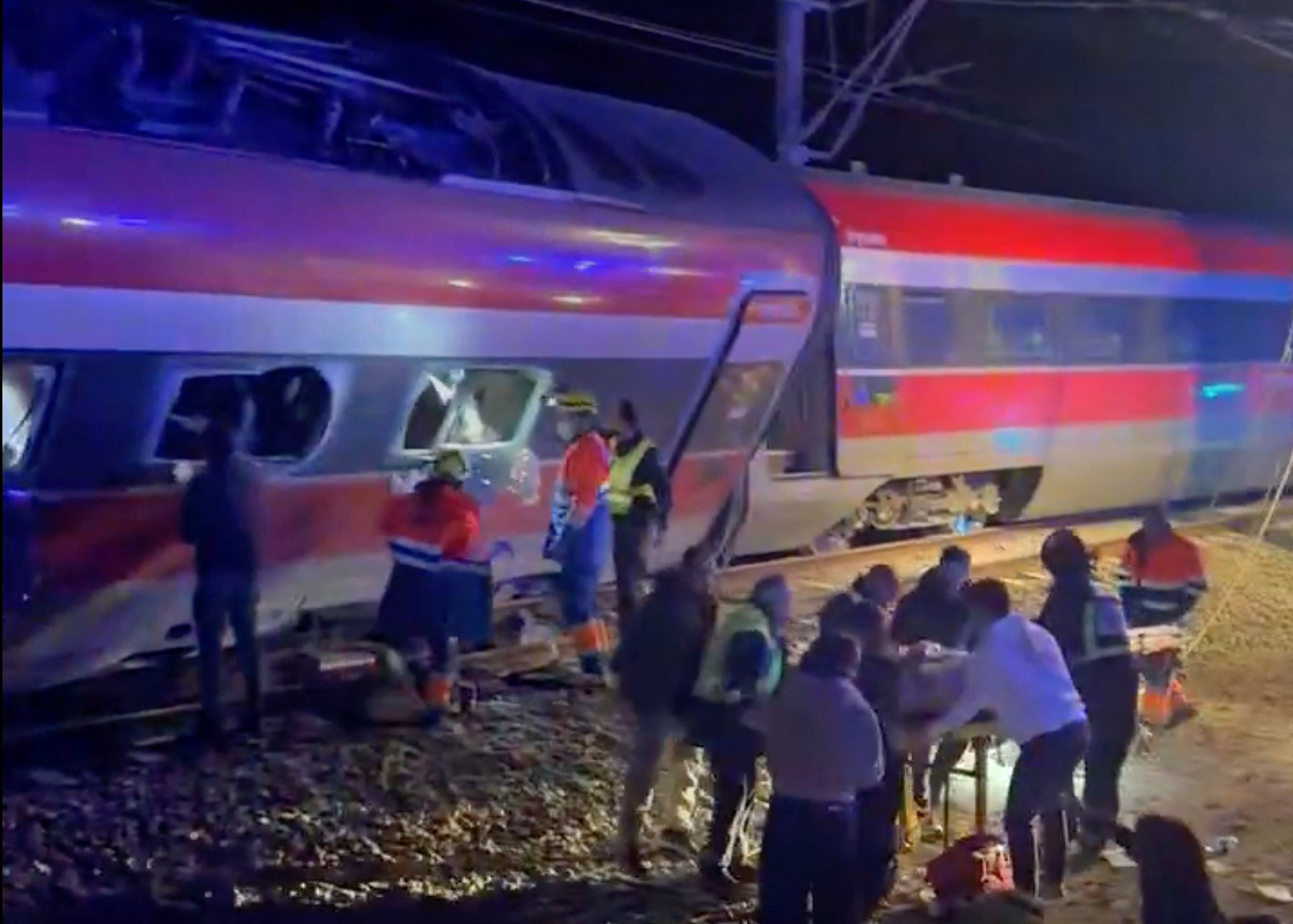 This video grab taken from UGC images posted on social media and verified by AFPTV teams in Madrid, shows emergency personnel working after a train accident in Adamuz, southern Spain, on January 18, 2026.