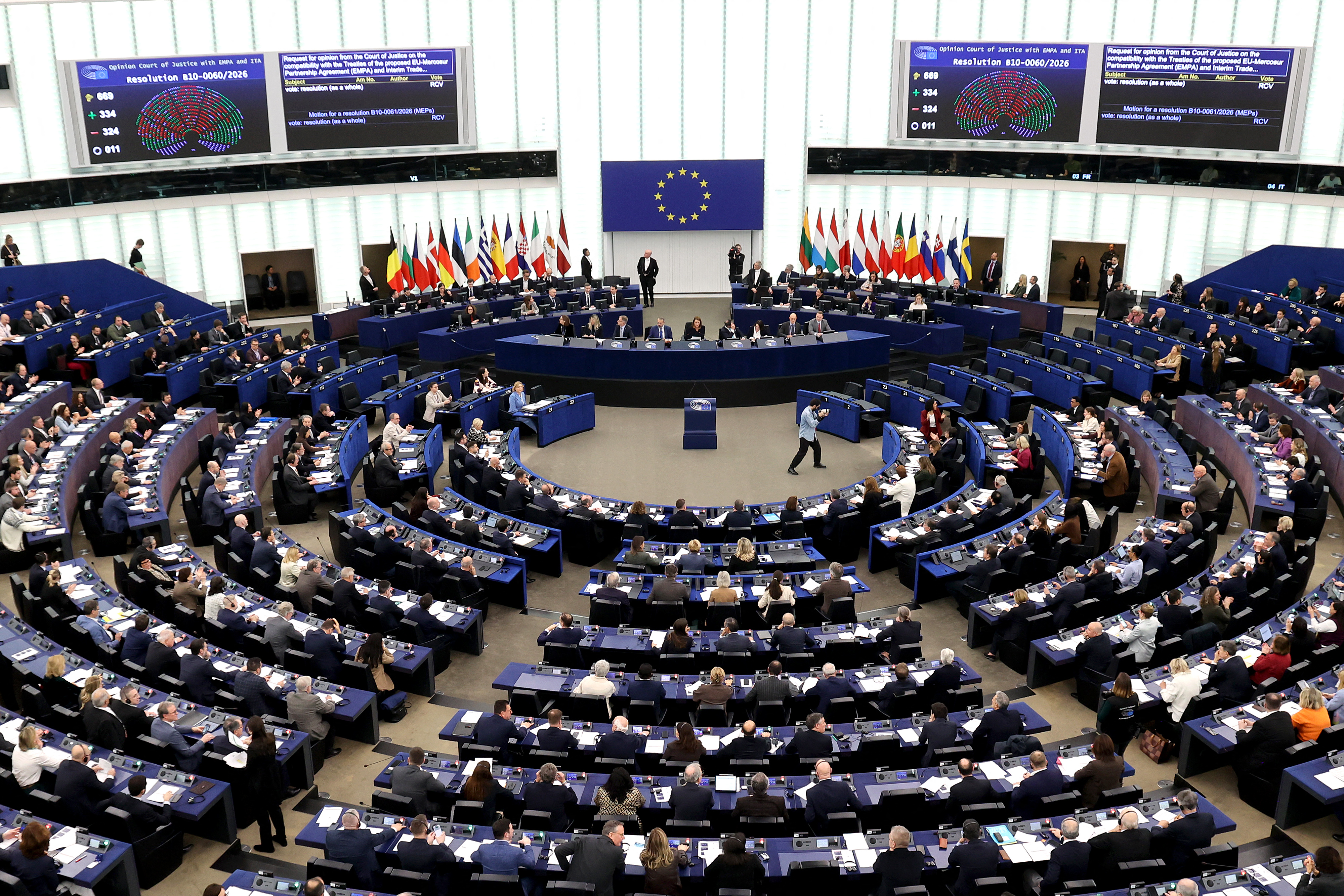 This photograph shows screens displaying the results of the vote on the legal referral concerning the Mercosur deal, and a general view of the hemicycle during a voting session at the European Parliament in Strasbourg, eastern France, on January 21, 2026.