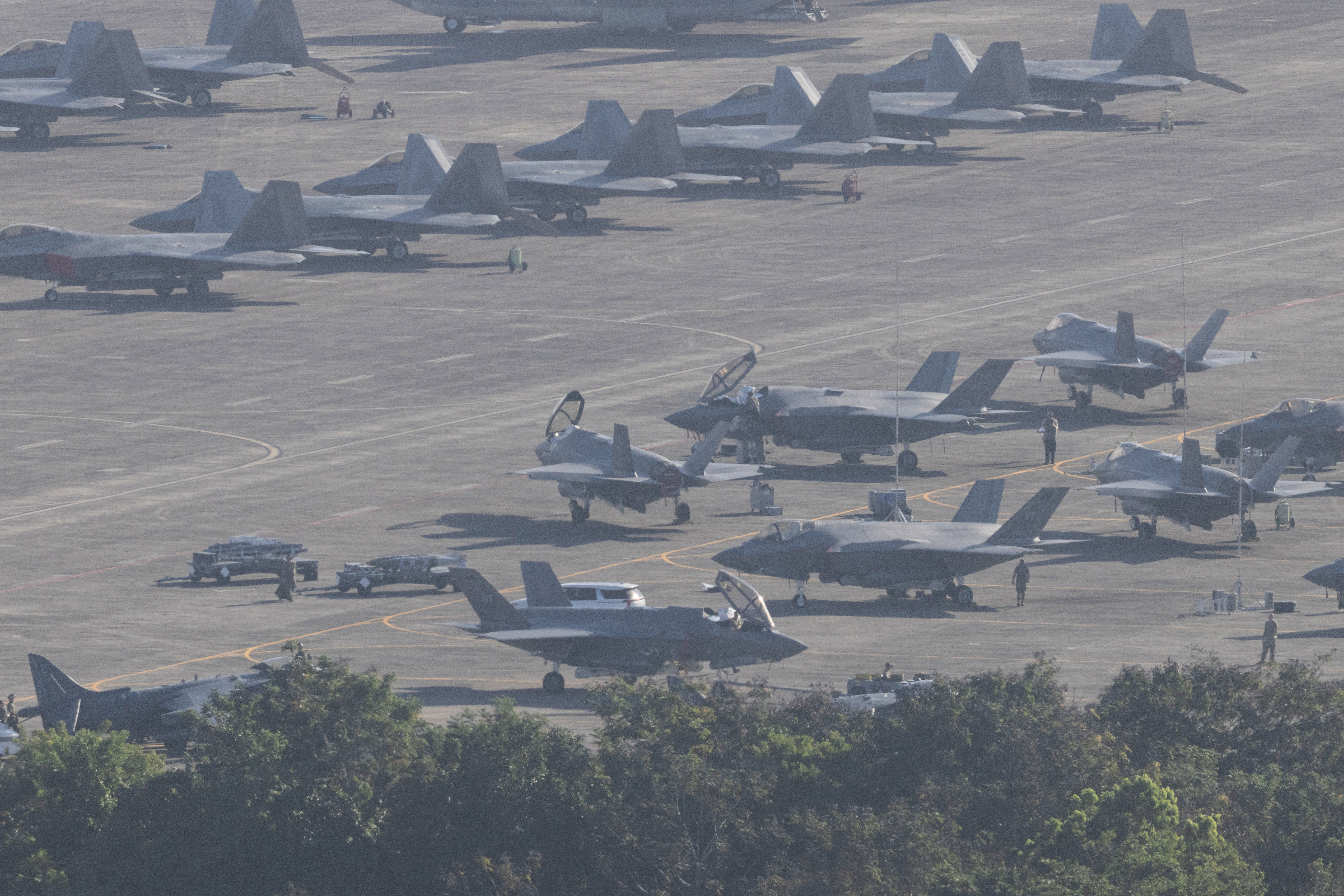 U.S. military aircraft are parked on the tarmac at Jose Aponte de la Torre Airport in Ceiba, Puerto Rico, Saturday, Jan. 3, 2025. (AP Photo/Alejandro Granadillo)