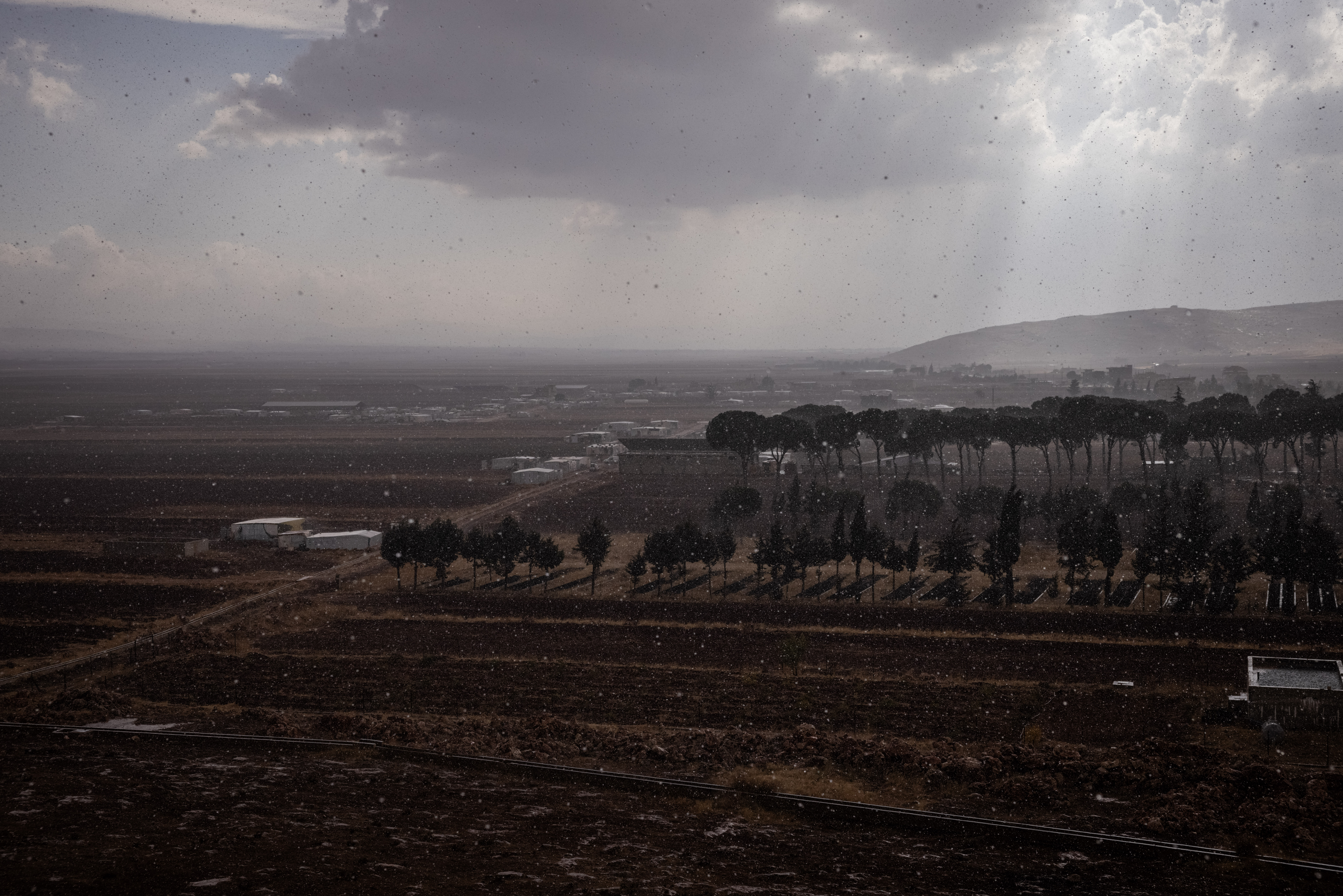 DEIR AL-AHMAR, LEBANON - NOVEMBER 2: Rain falls on the Bekaa Valley seen from a school housing people displaced from the city of Baalbek on November 2, 2024 in Deir Al-Ahmar, Lebanon. Israel has increasingly targeted Lebanon's eastern city of Baalbek and the surrounding Bekaa valley, considered a bastion of Hezbollah support. Earlier this week, Israel ordered residents of Baalbek and neighboring towns to evacuate before a new wave of strikes. (Photo by Ed Ram/Getty Images)