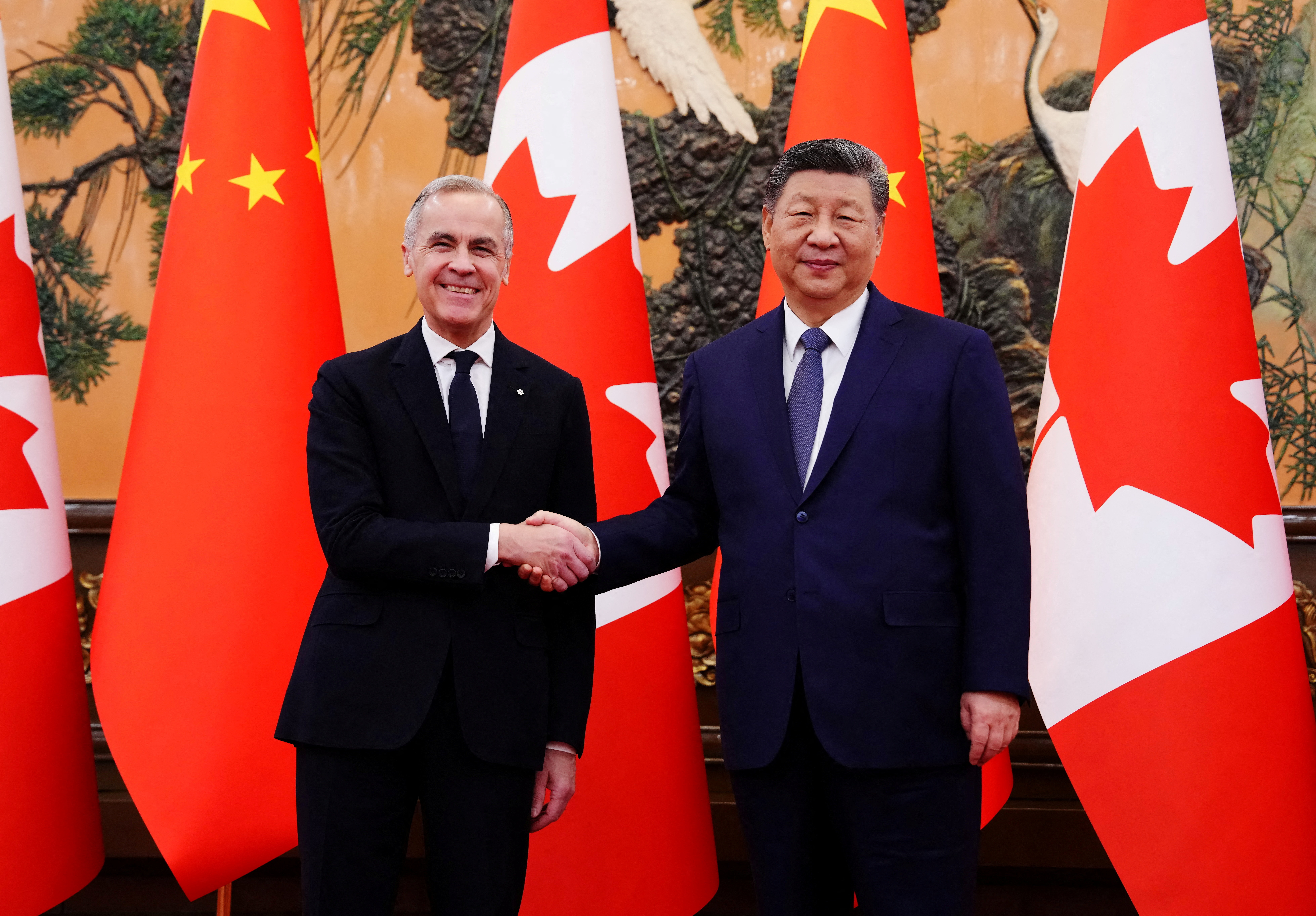 Canadian Prime Minister Mark Carney shakes hands with President of China Xi Jinping at the Great Hall of the People in Beijing, China on Friday, Jan. 16, 2026. Sean Kilpatrick/Pool via REUTERS