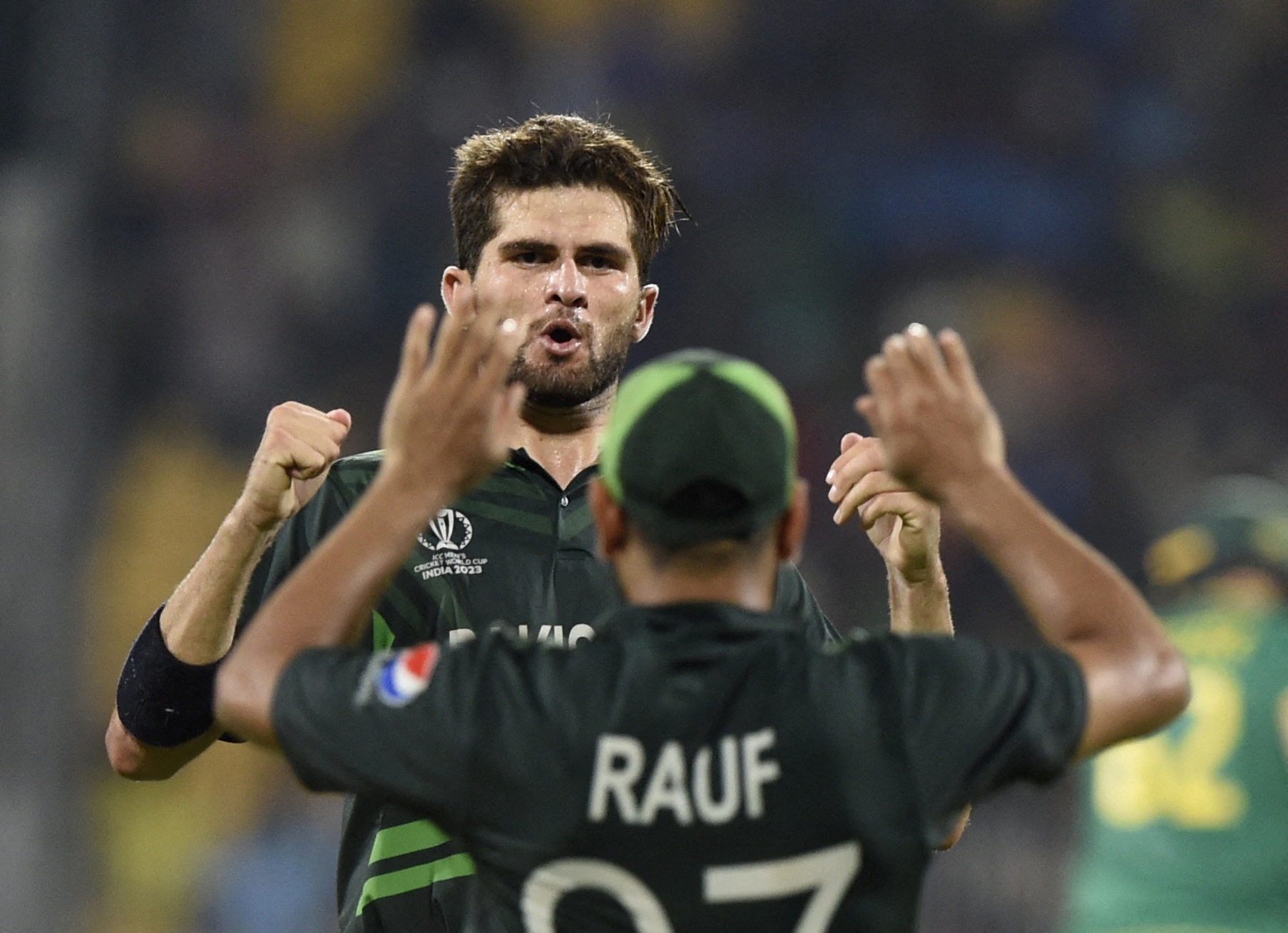 Cricket - ICC Cricket World Cup 2023 - Pakistan v South Africa - M. A. Chidambaram Stadium, Chennai, India - October 27, 2023 Pakistan's Shaheen Shah Afridi celebrates with Haris Rauf after taking the wicket of South Africa's Gerald Coetzee, caught by Mohammad Rizwan REUTERS/Samuel Rajkumar