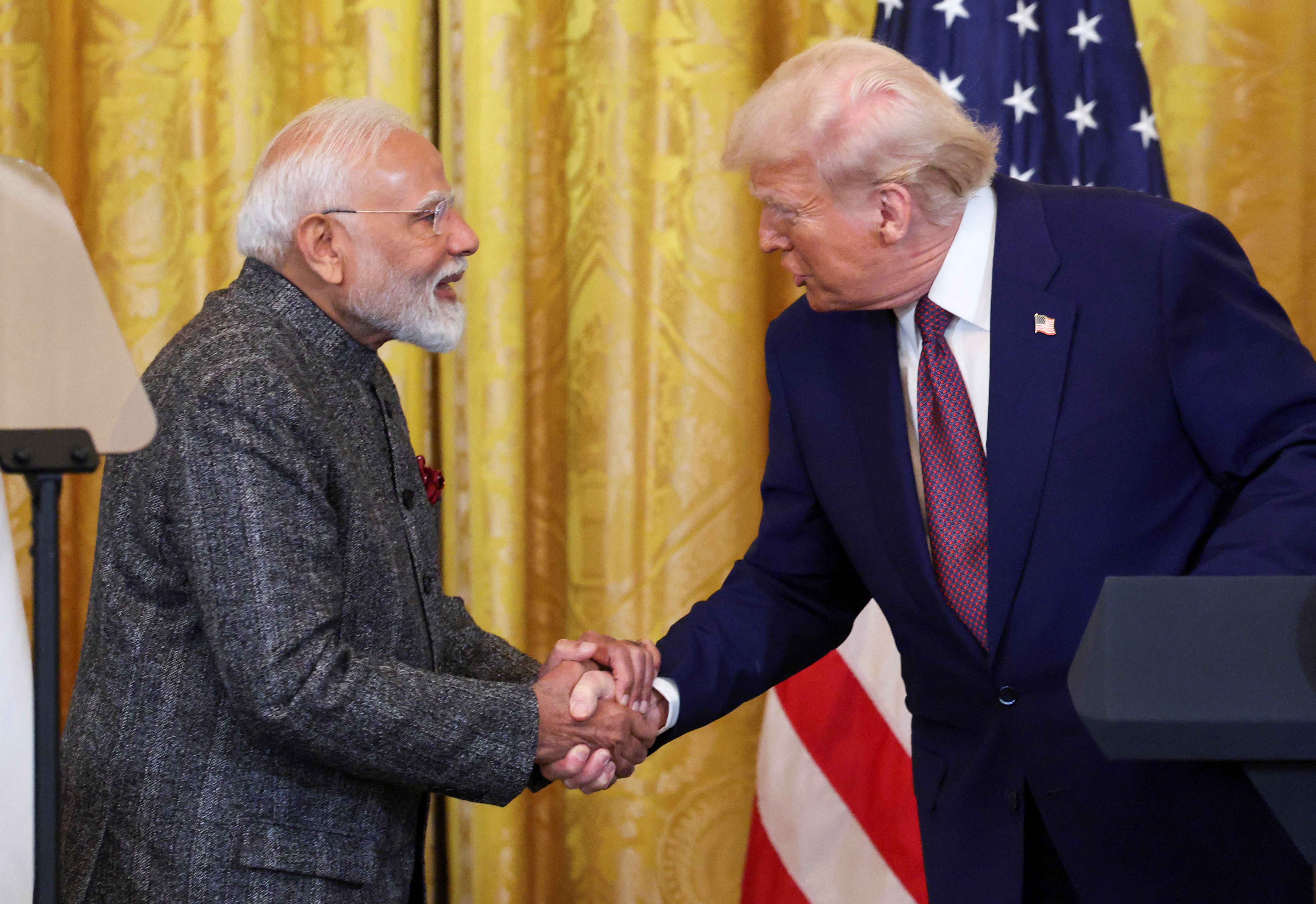 U.S. President Donald Trump and Indian Prime Minister Narendra Modi shake hands as they attend a joint press conference at the White House in Washington, D.C., U.S., February 13, 2025. REUTERS/Kevin Lamarque