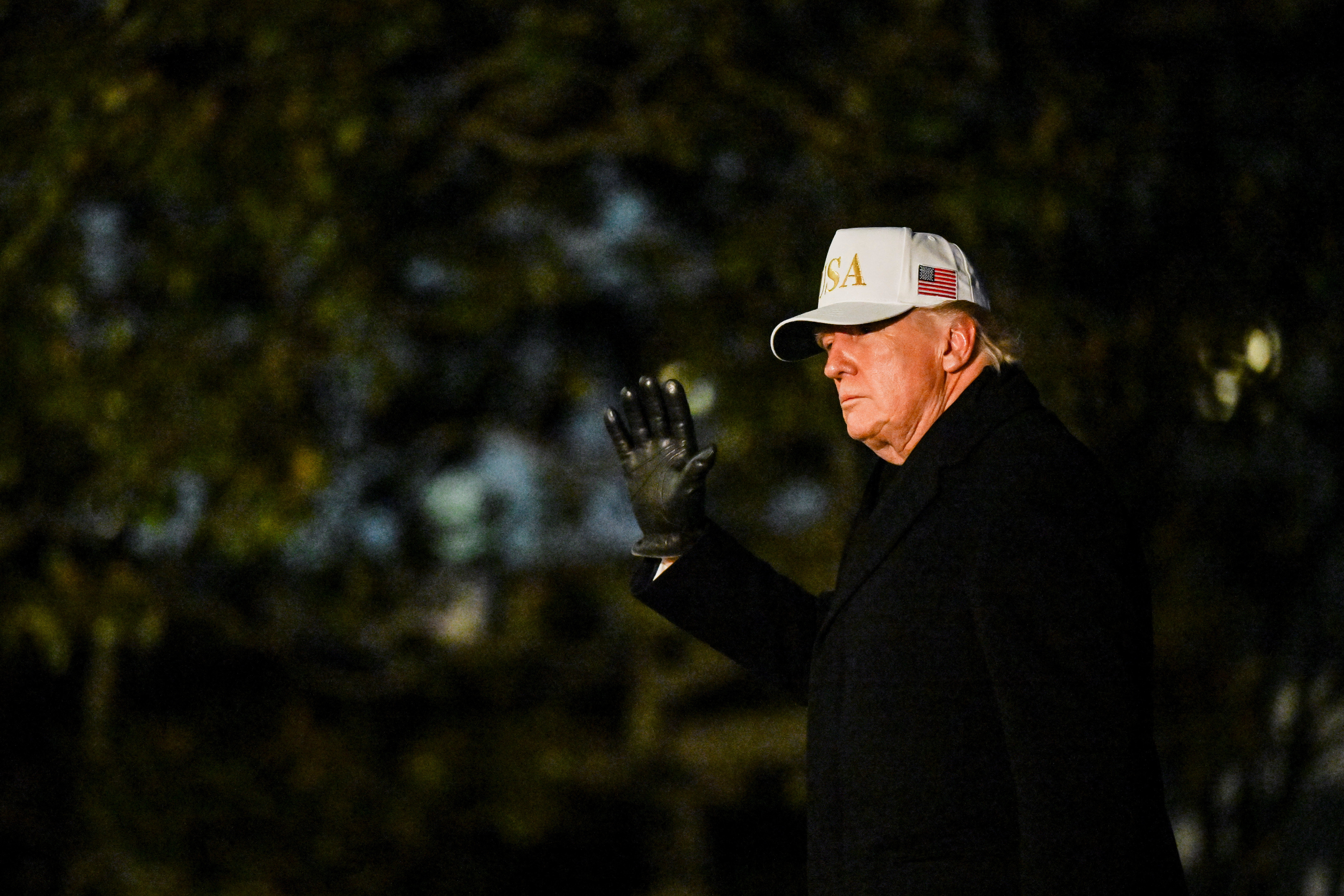 U.S. President Donald Trump waves as he arrives on the South Lawn of the White House in Washington DC