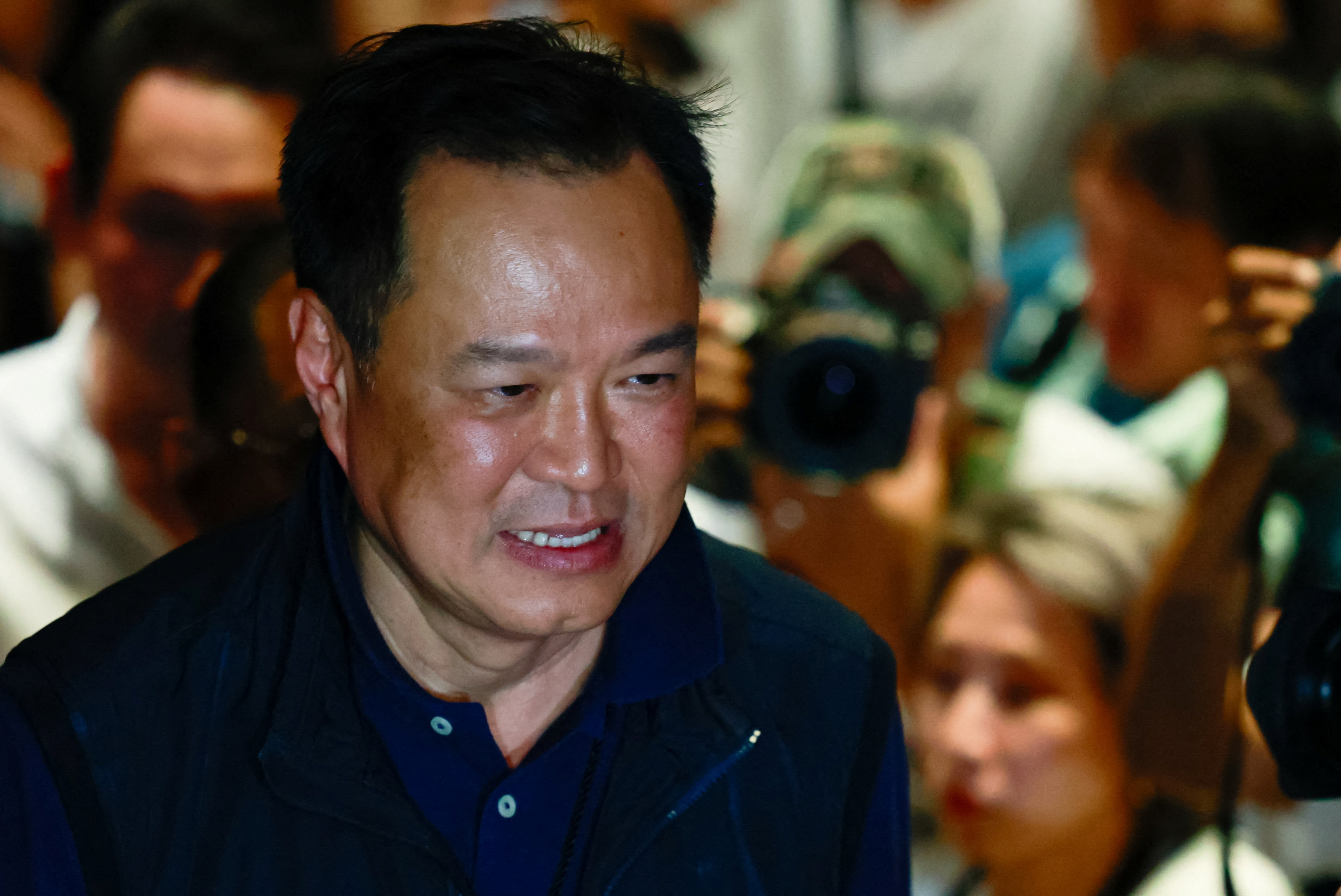 Thailand's caretaker Prime Minister Anutin Charnvirakul, Bhumjaithai Party leader and prime ministerial candidate, arrives at the party headquarters on the day of the general election, in Bangkok, Thailand, February 8, 2026. REUTERS/Patipat Janthong