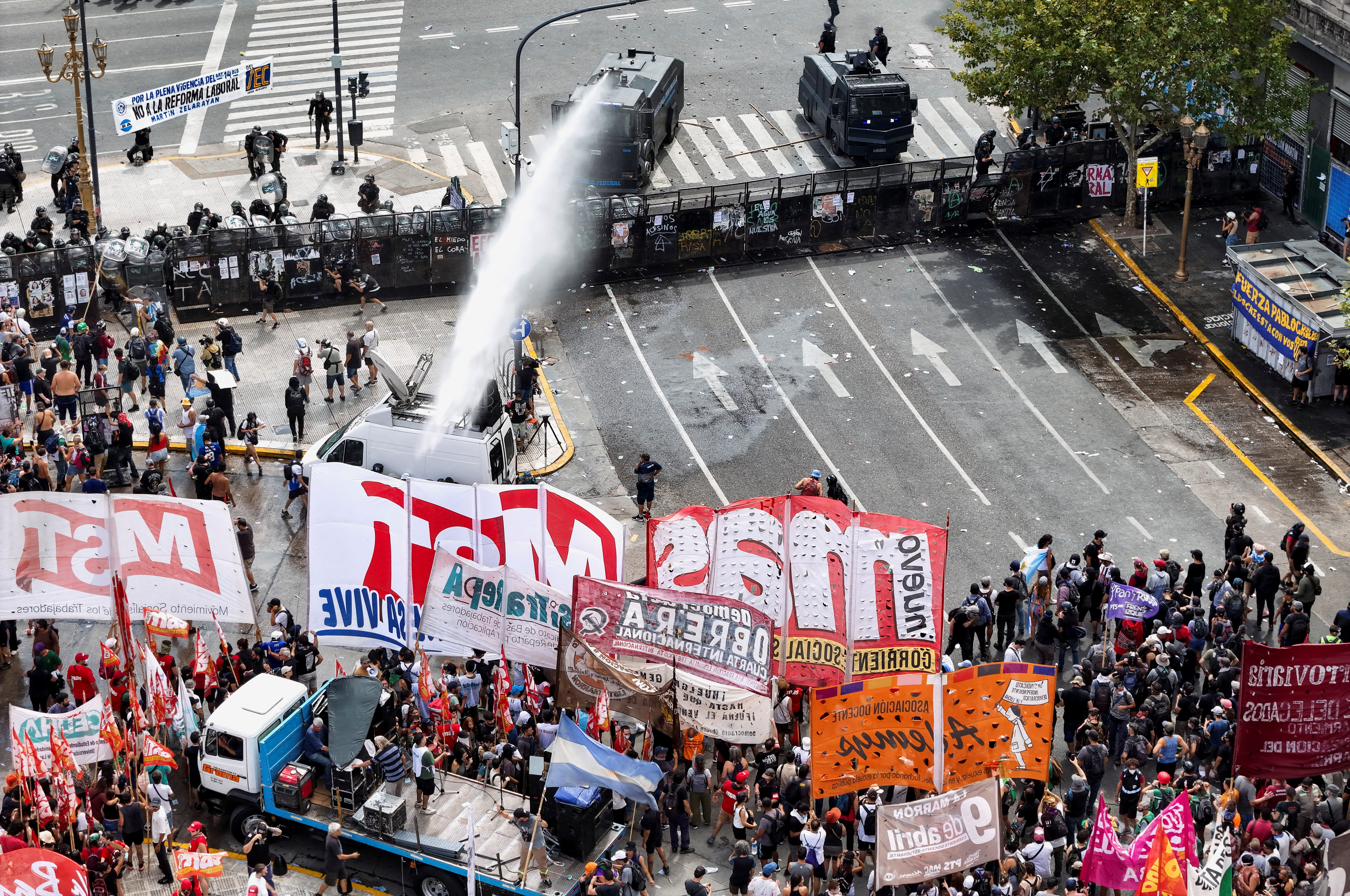 Police use a spray cannon against labour protesters