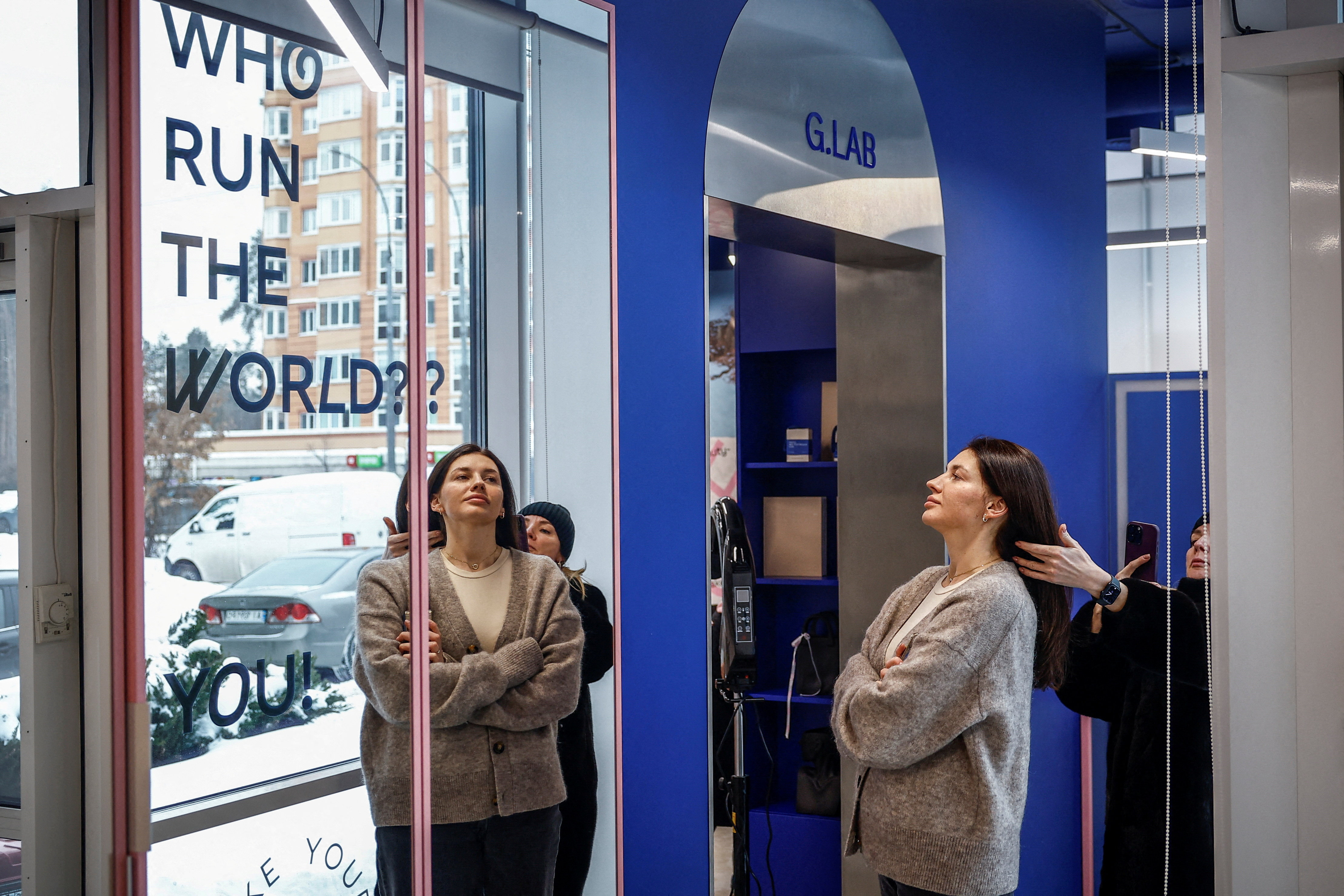 Iryna, a beauty salon manager, participates in the recording of a video for the salon’s social media as it continues operating despite frequent power outages after recent Russian missile and drone strikes damaged critical infrastructure, amid Russia’s attack on Ukraine, in Irpin, Kyiv region, Ukraine, February 6, 2026. REUTERS/Alina Smutko TPX IMAGES OF THE DAY