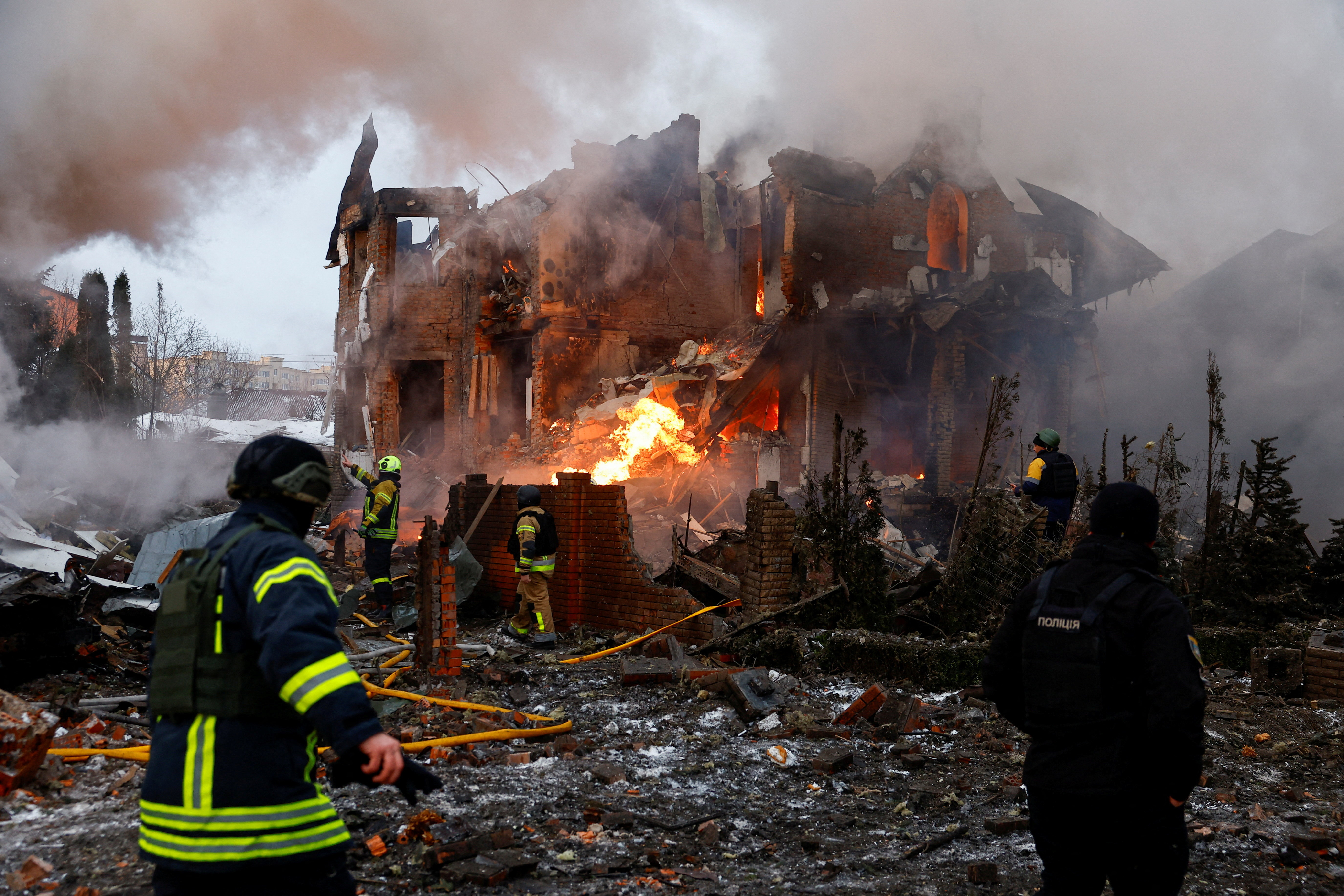 Firefighters work at the site of a residential building damaged during Russian drone and missile strikes, amid Russia's attack on Ukraine, in Kyiv, Ukraine, February 22, 2026. REUTERS/Alina Smutko TPX IMAGES OF THE DAY