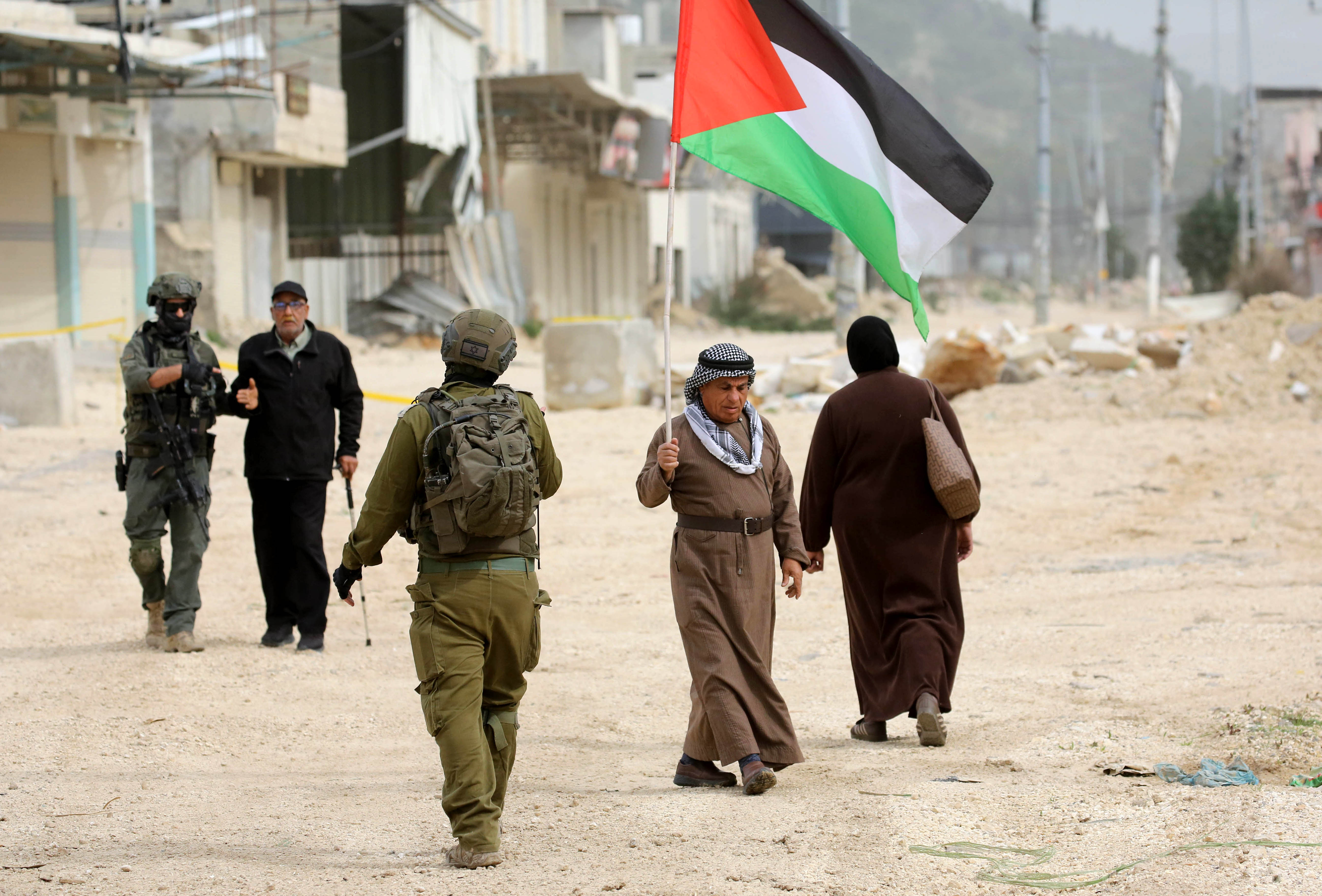 Displaced Palestinians in the Nur Shams refugee camp in Tulkarem in the occupied West Bank protest to demand the right to return to their homes on Monday [Nedal Eshtayah/Anadolu]