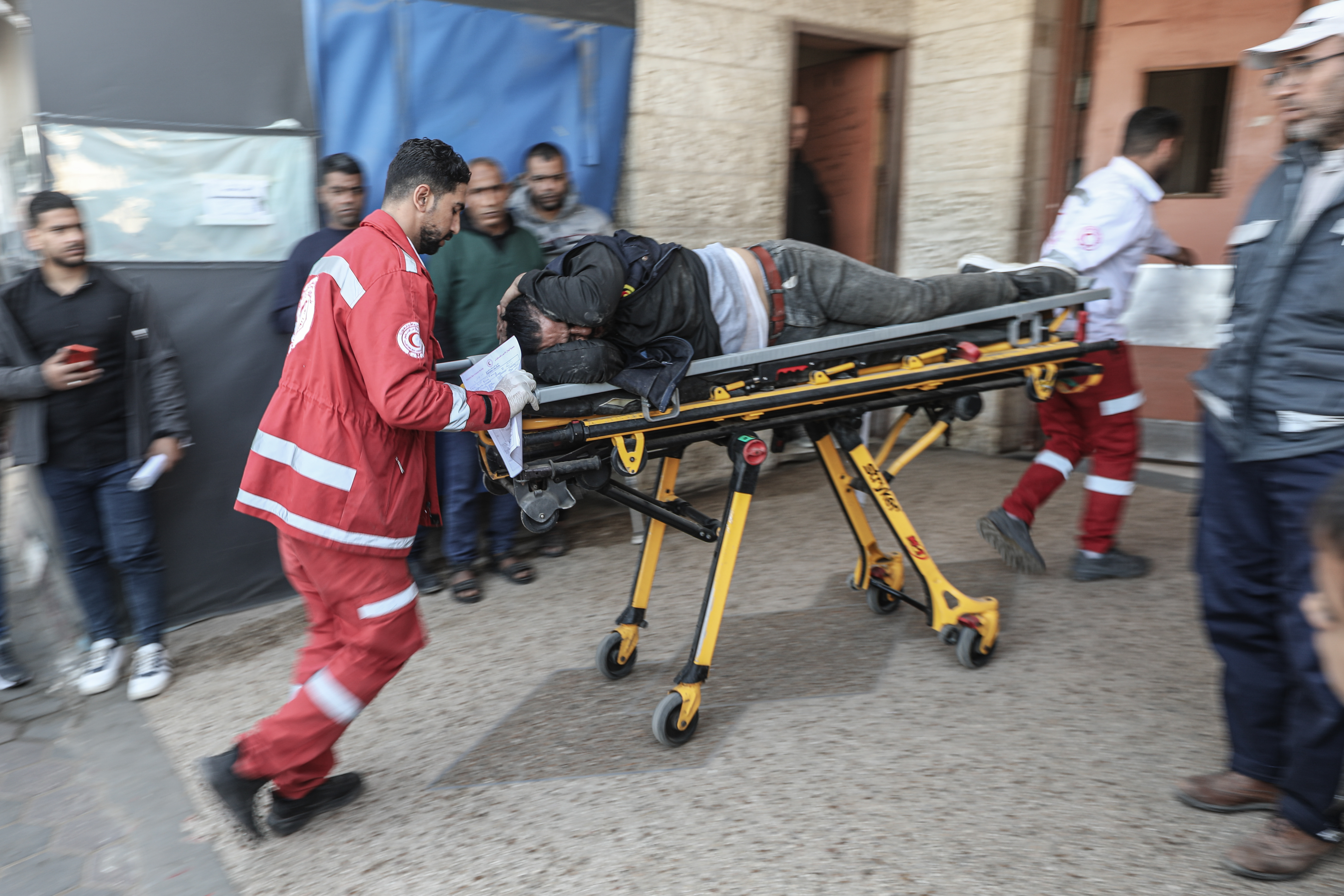 A Palestinian injured in an Israeli army attack arrives at Al-Aqsa Martyrs Hospital