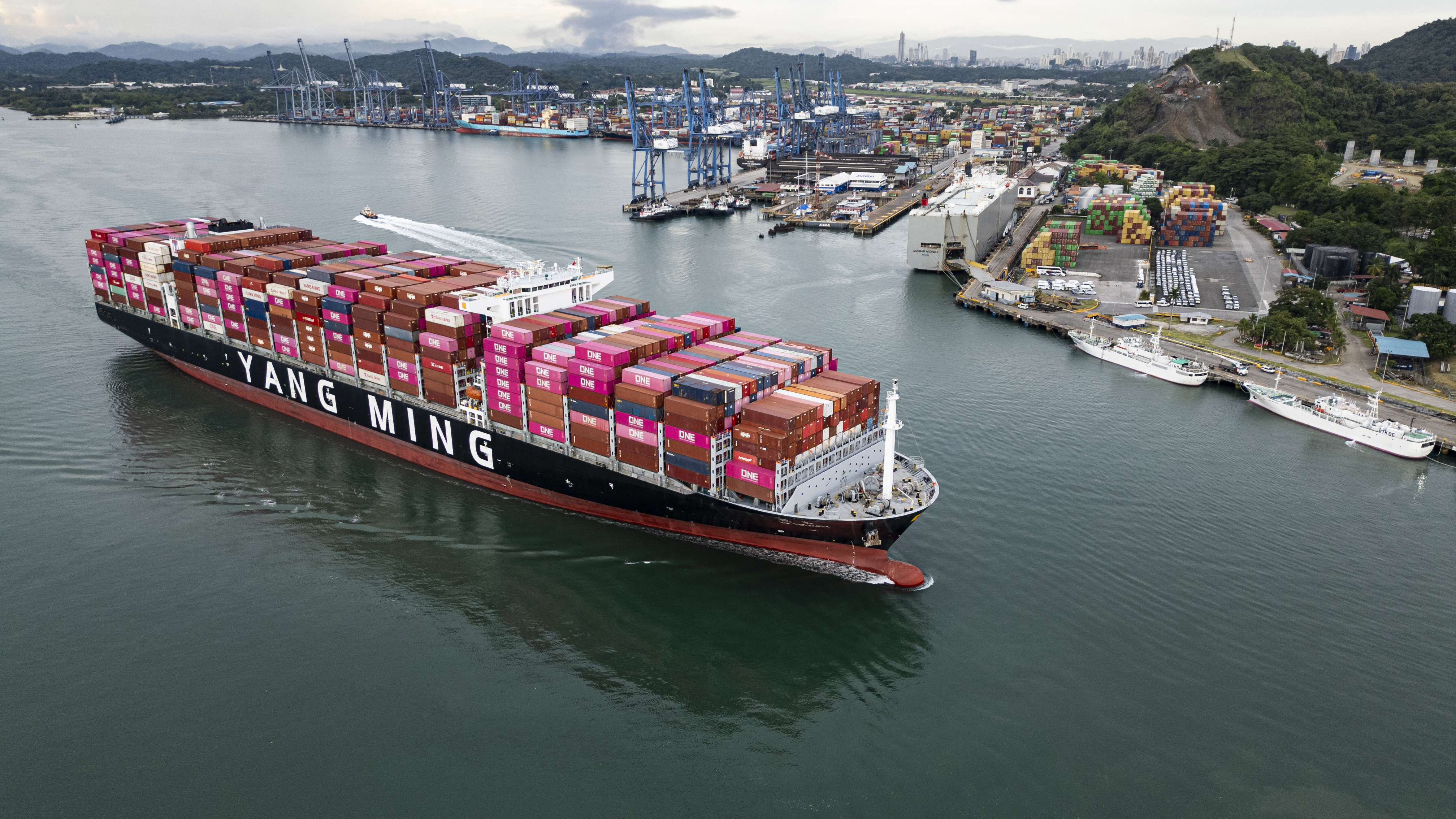 This aerial view shows the Taiwanese cargo ship Yang Ming sailing out of the Panama Canal on the Pacific side in Panama City on October 6, 2025. (Photo by MARTIN BERNETTI / AFP)