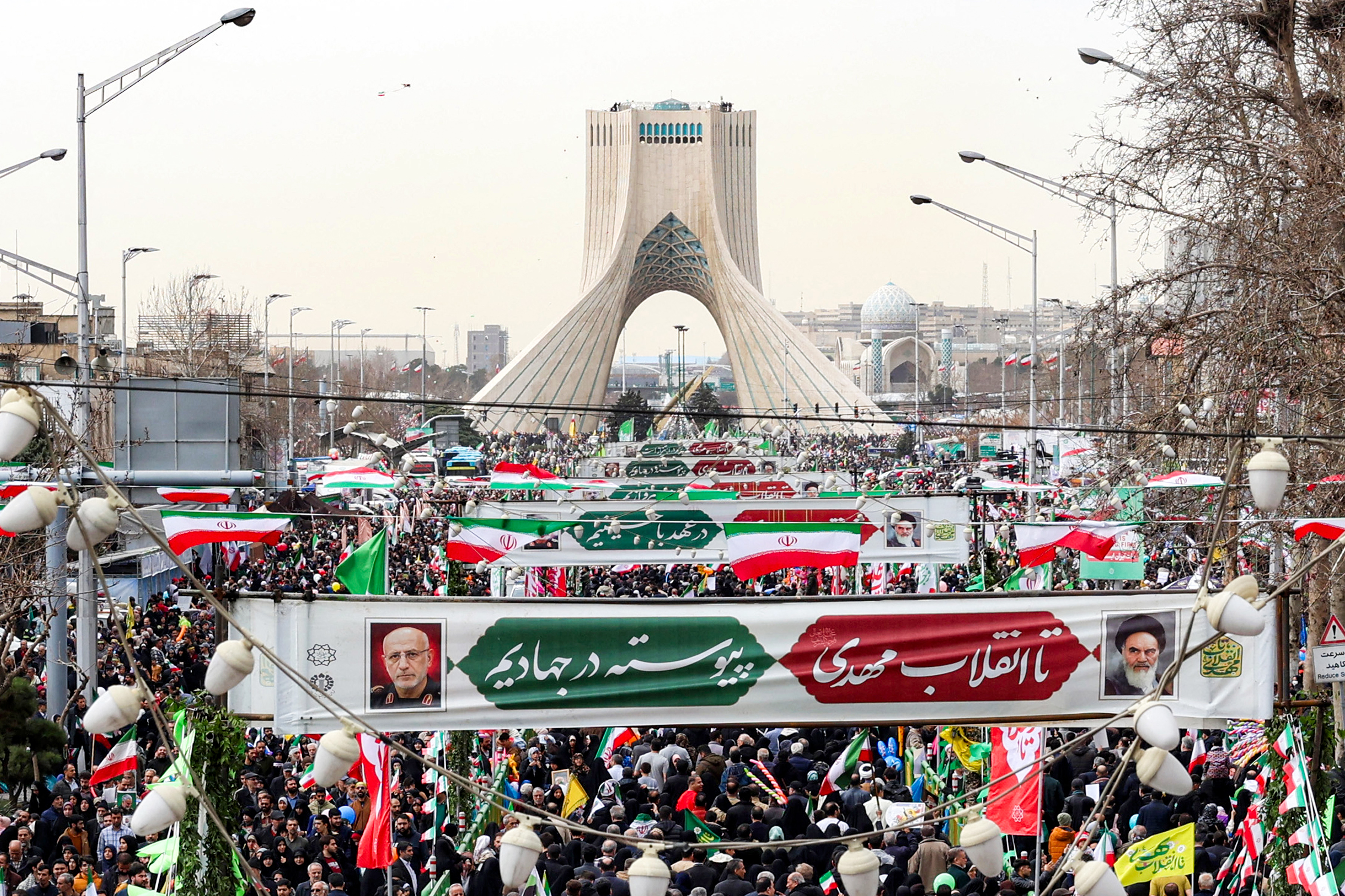 People march near Azadi Tower in Tehran