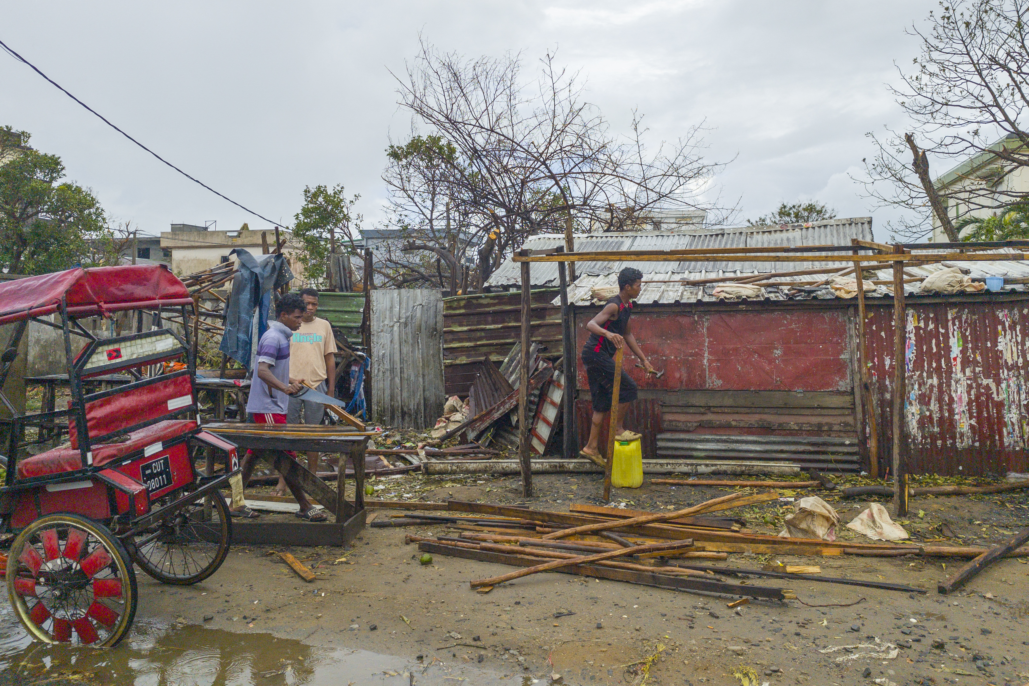 Residents rebuild a structure in the city of Toamasina, on the east coast of Madagascar, struck by Tropical Cyclone Gezani on February 12, 2026.