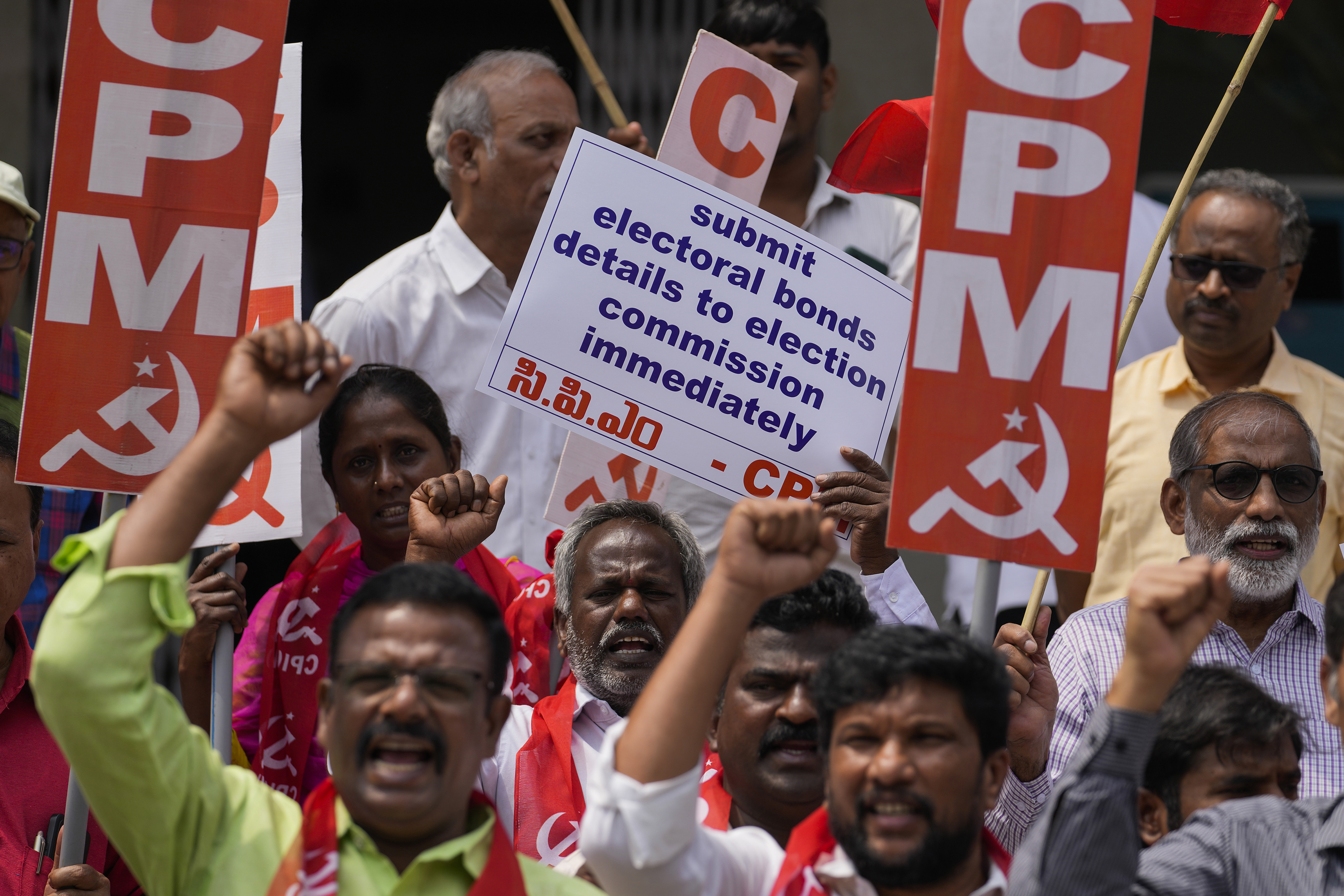 Activists of Communist Party of India (Marxist) protest in Hyderabad, India, against the State Bank of India seeking more time to disclose details of “electoral bonds” to the Election Commission of India, Monday, March 11, 2024. India’s Supreme Court had last month struck down “electoral bonds”, a controversial election funding system that allowed individuals and companies to send unlimited donations to political parties without the need to disclose donor identity. (AP Photo/Mahesh Kumar A)