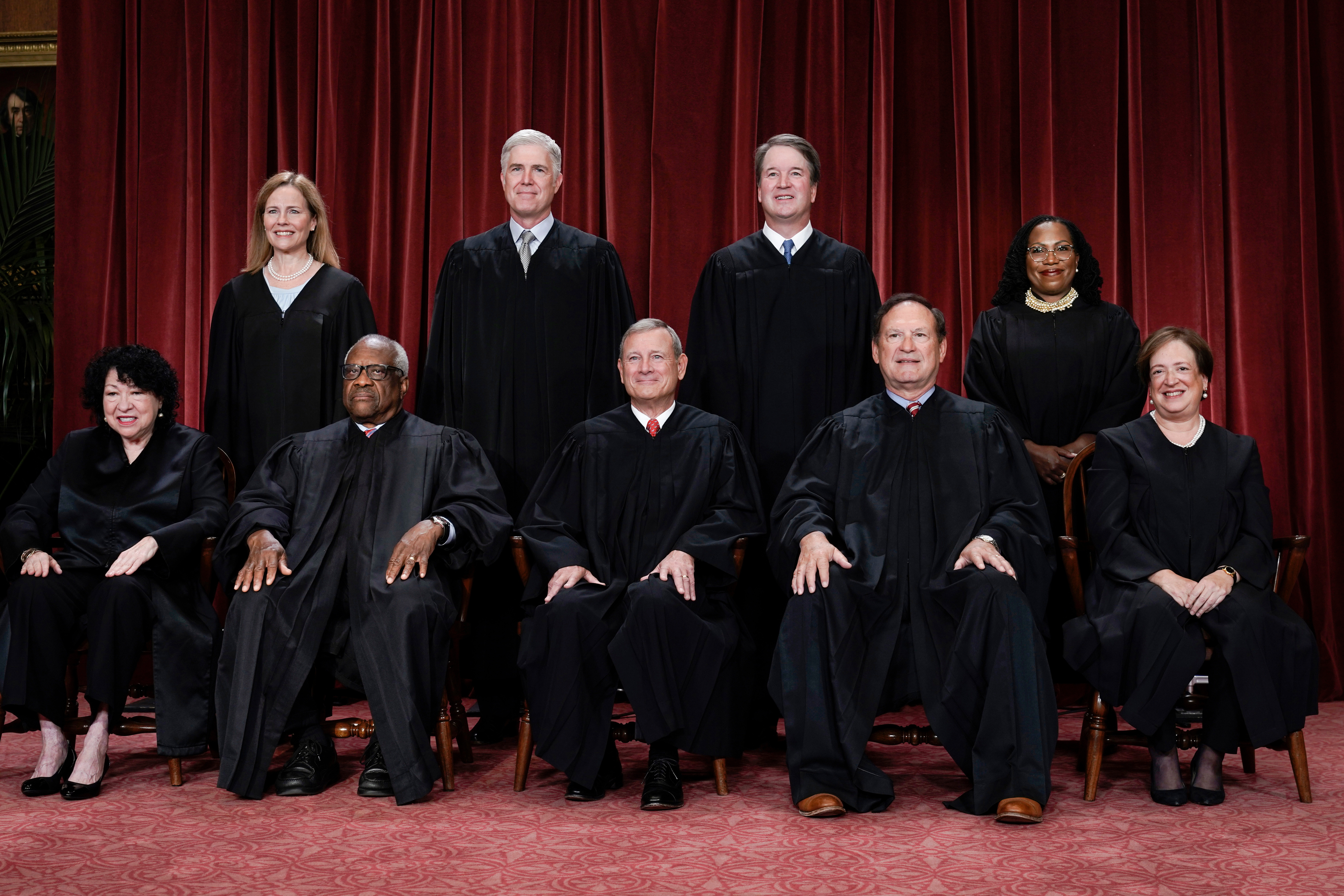 Members of the Supreme Court sit for a new group portrait at the Supreme Court building i
