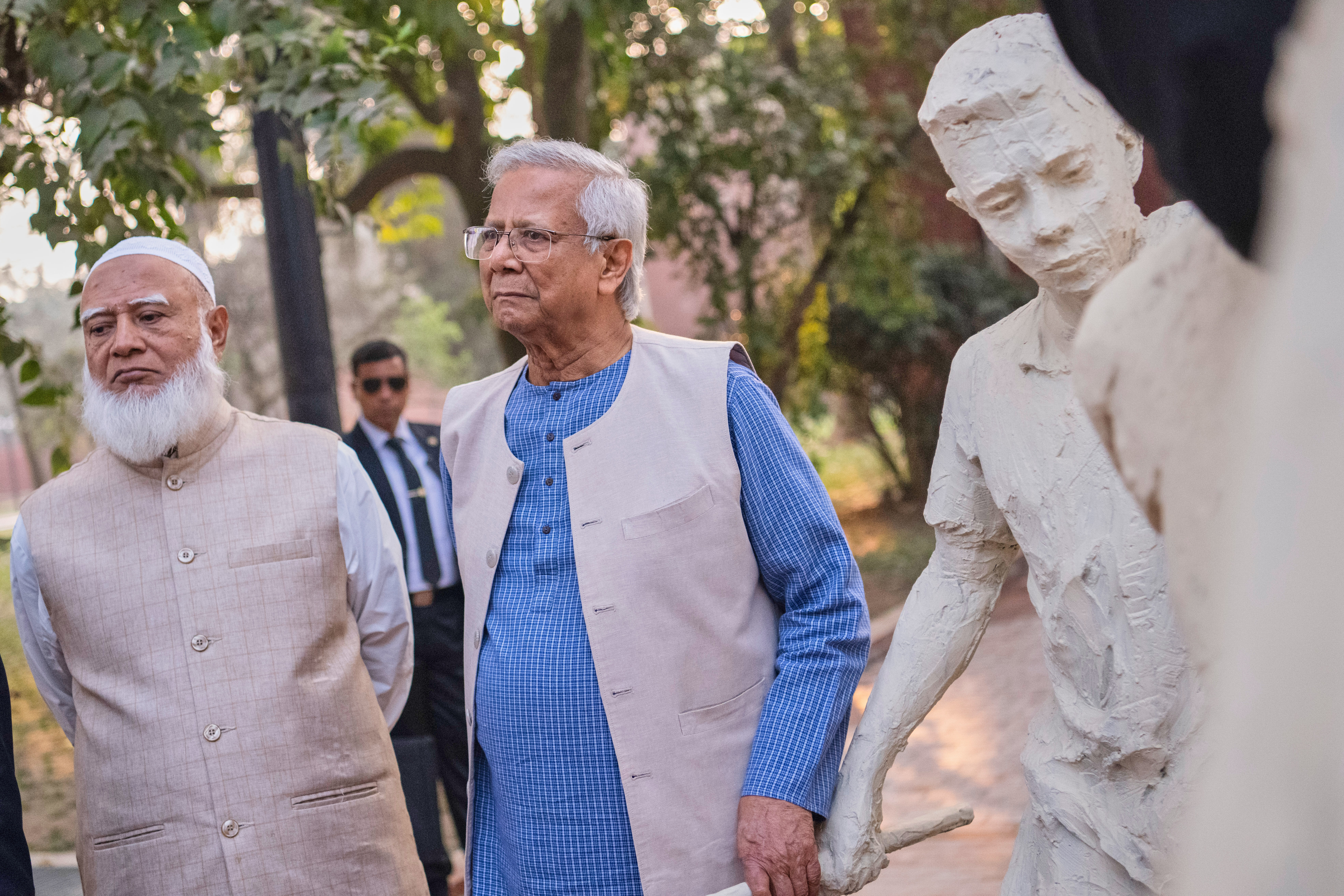 Head of Bangladesh's interim government Muhammad Yunus, center, with Bangladesh Jamaat-e-Islami party leader Ameer Shafiqur Rahman, inaugurate the July Uprising Memorial Museum, once the official residence of Bangladesh's ousted Prime Minister Sheikh Hasina, in Dhaka, Bangladesh, Tuesday, Jan. 20, 2026. (AP Photo/Mahmud Hossain Opu)