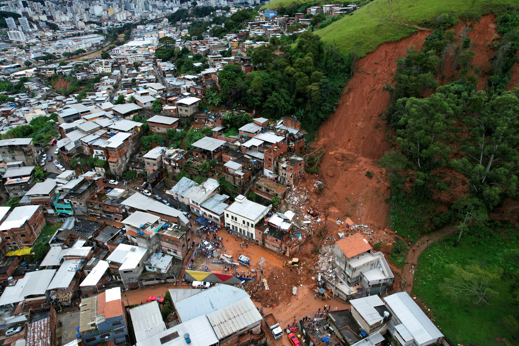 the aftermath of a landslide prompted by flooding
