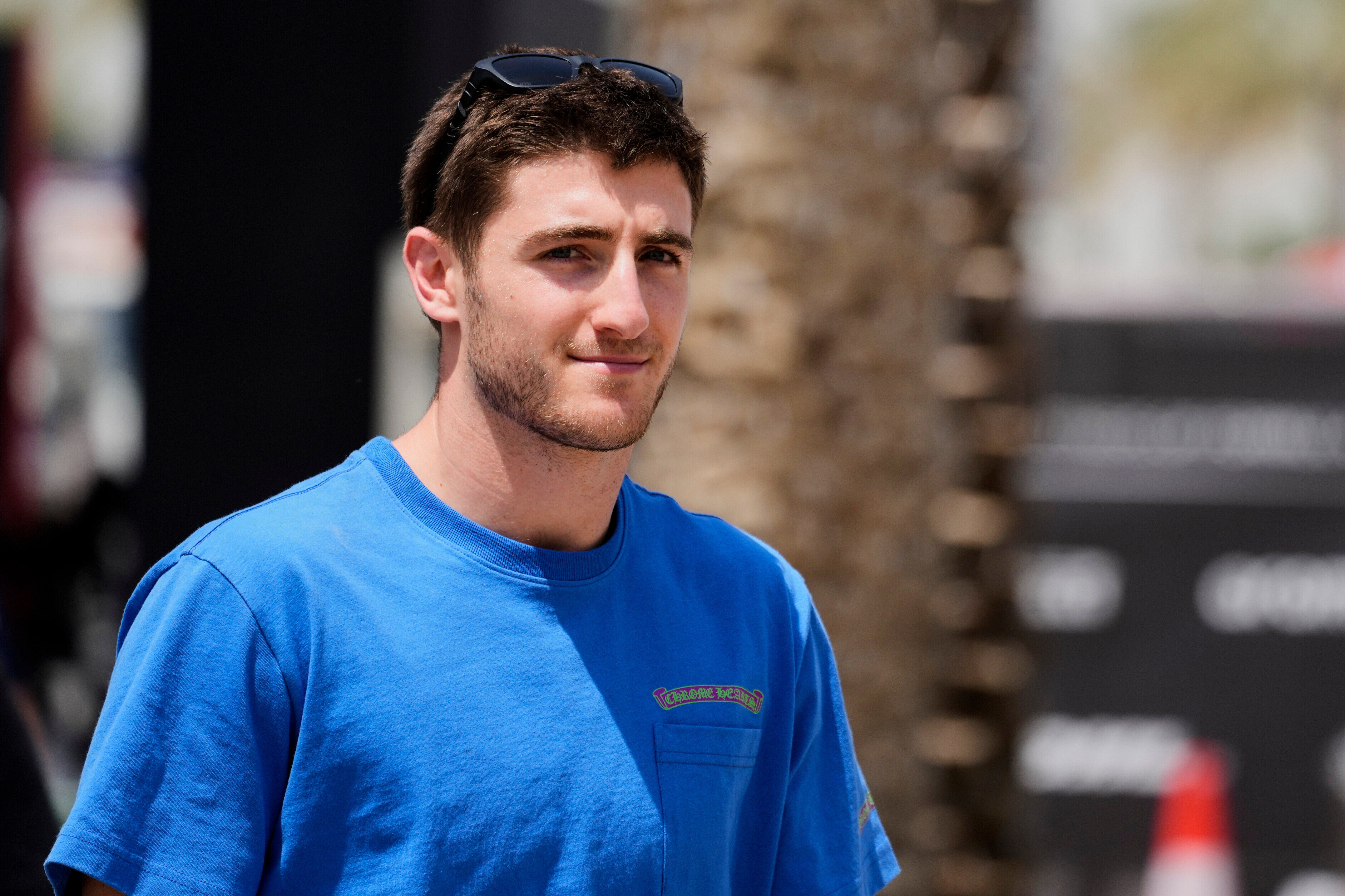 Alpine driver Jack Doohan of Australia walks through the paddock ahead of the Formula One Bahrain Grand Prix
