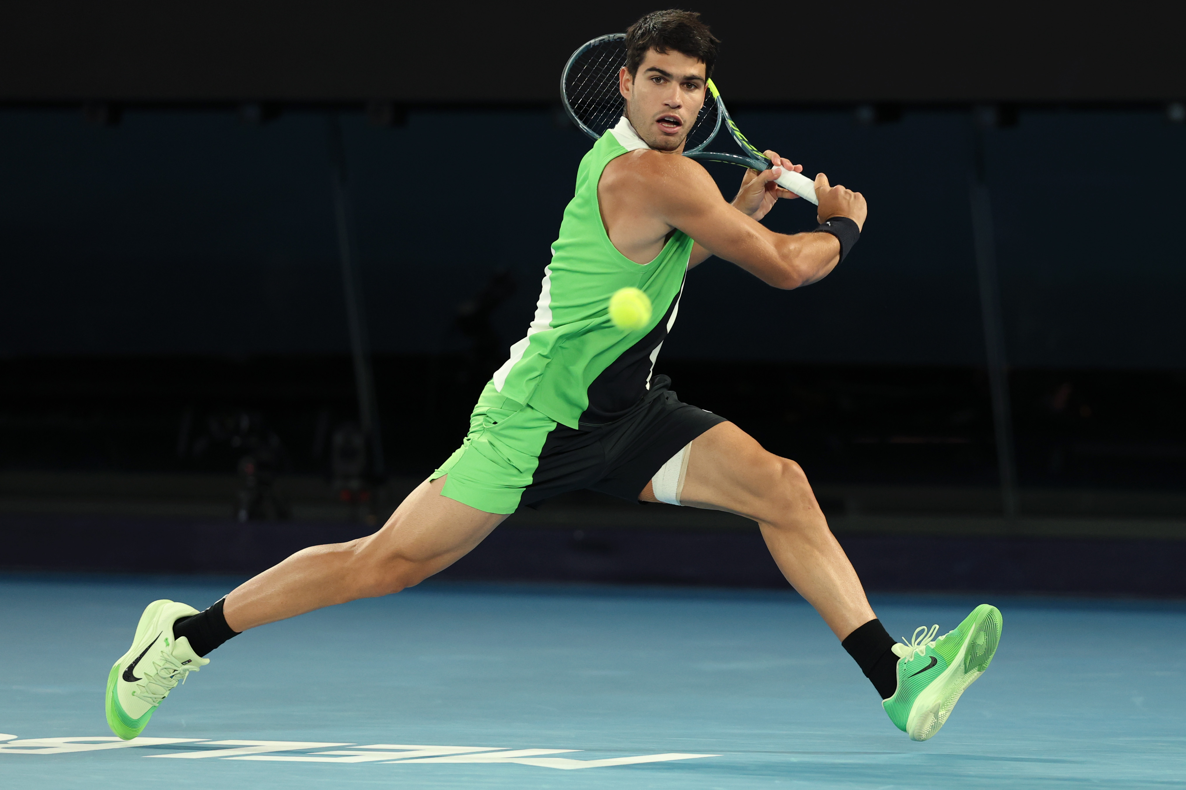 MELBOURNE, AUSTRALIA - FEBRUARY 01: Carlos Alcaraz of Spain plays a backhand in the Men's Singles Final against Novak Djokovic of Serbia during day 15 of the 2026 Australian Open at Melbourne Park on February 01, 2026 in Melbourne, Australia. (Photo by Clive Brunskill/Getty Images)
