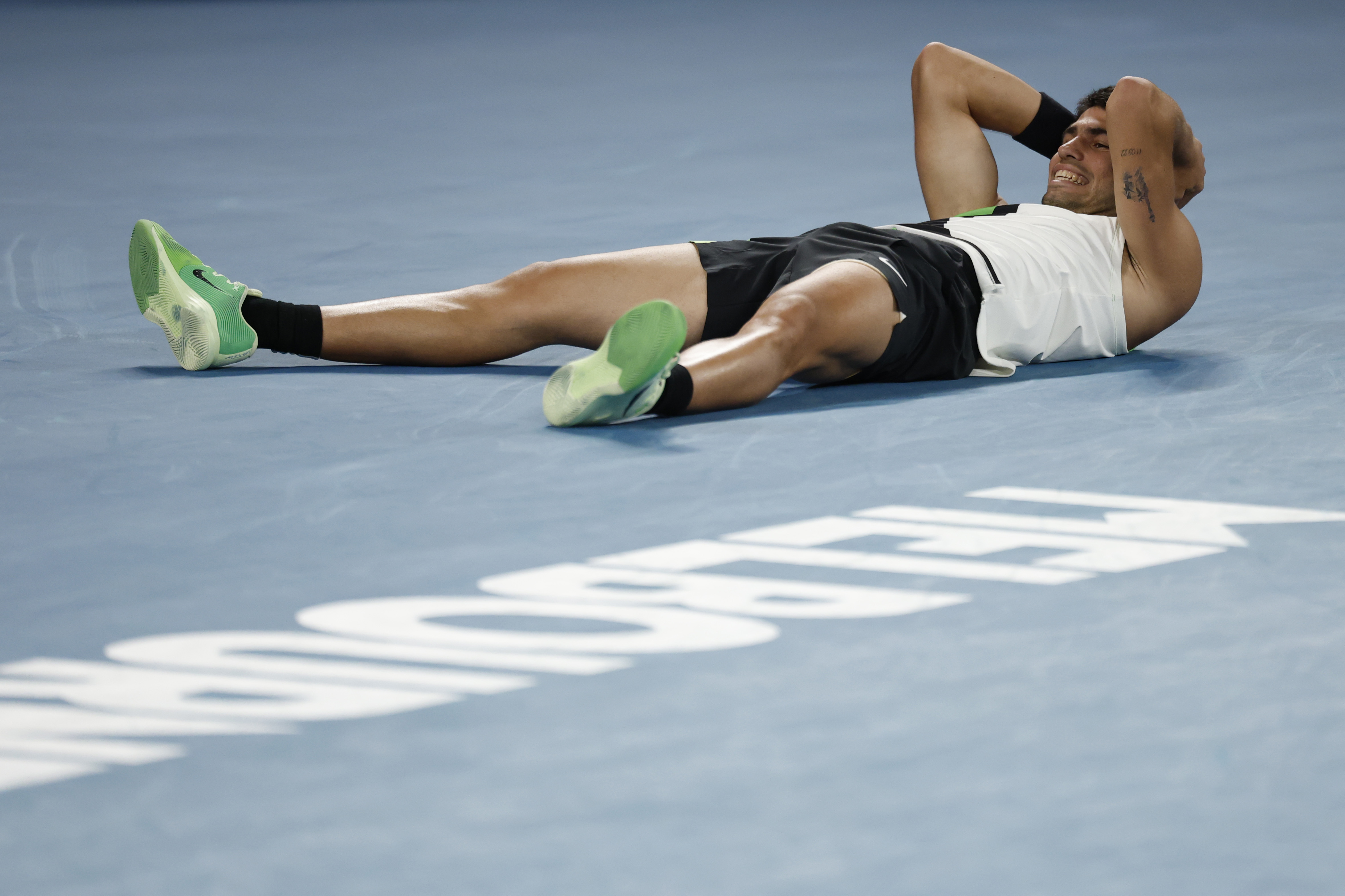 MELBOURNE, AUSTRALIA - FEBRUARY 01: Carlos Alcaraz of Spain celebrates his victory in the Men's Singles Final against Novak Djokovic of Serbia during day 15 of the 2026 Australian Open at Melbourne Park on February 01, 2026 in Melbourne, Australia. (Photo by Darrian Traynor/Getty Images)