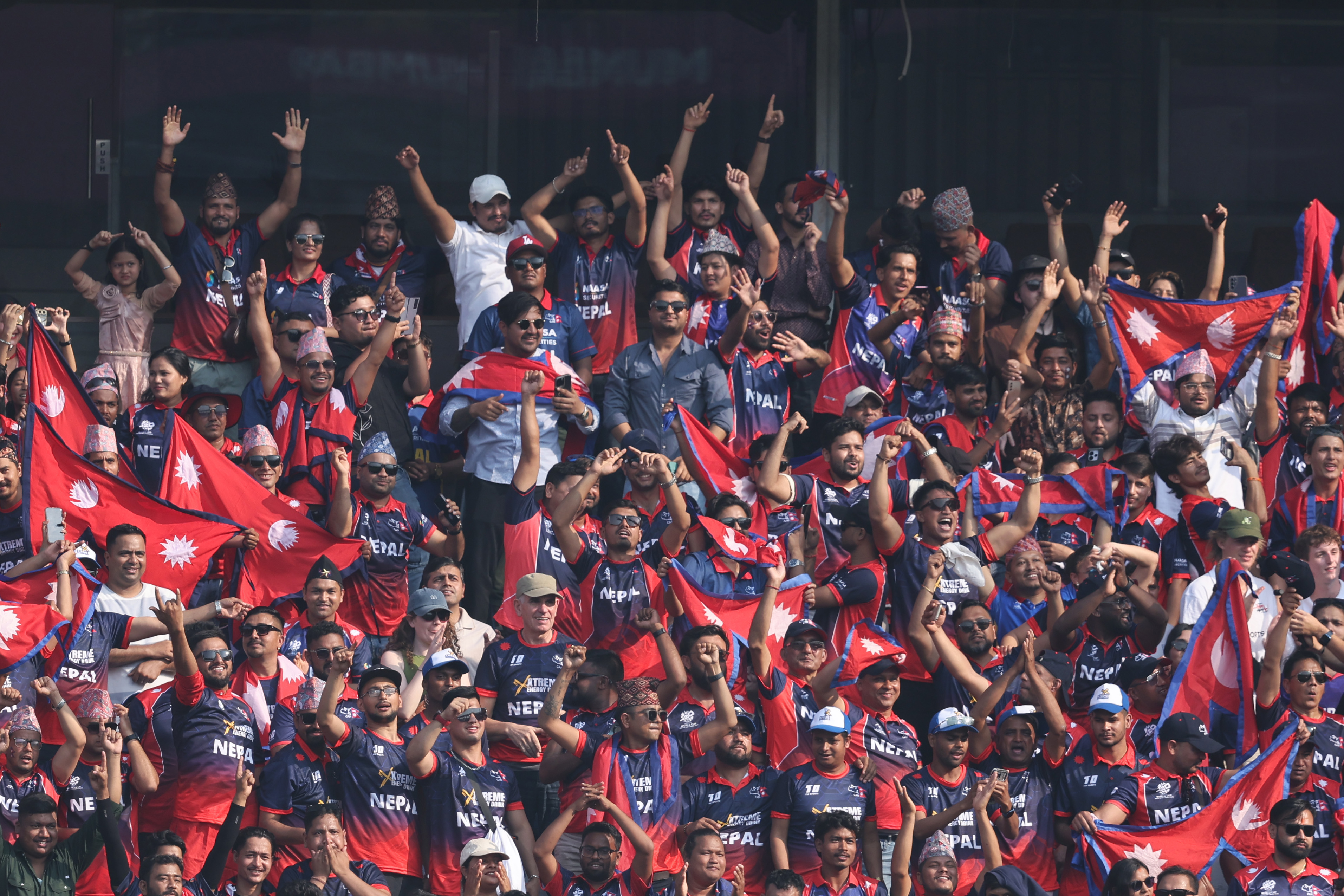 MUMBAI, INDIA - FEBRUARY 08: Supporters cheer during the ICC Men's T20 World Cup India & Sri Lanka 2026 match between England and Nepal at Wankhede Stadium on February 08, 2026 in Mumbai, India. (Photo by Pankaj Nangia/Getty Images)