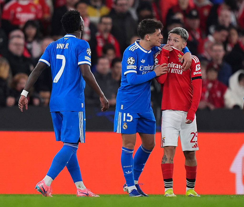 Gianluca Prestianni of Benfica speaks towards Vinicius Junior of Real Madrid during the UEFA Champions League 2025/26 League Knockout Play-off First Leg match