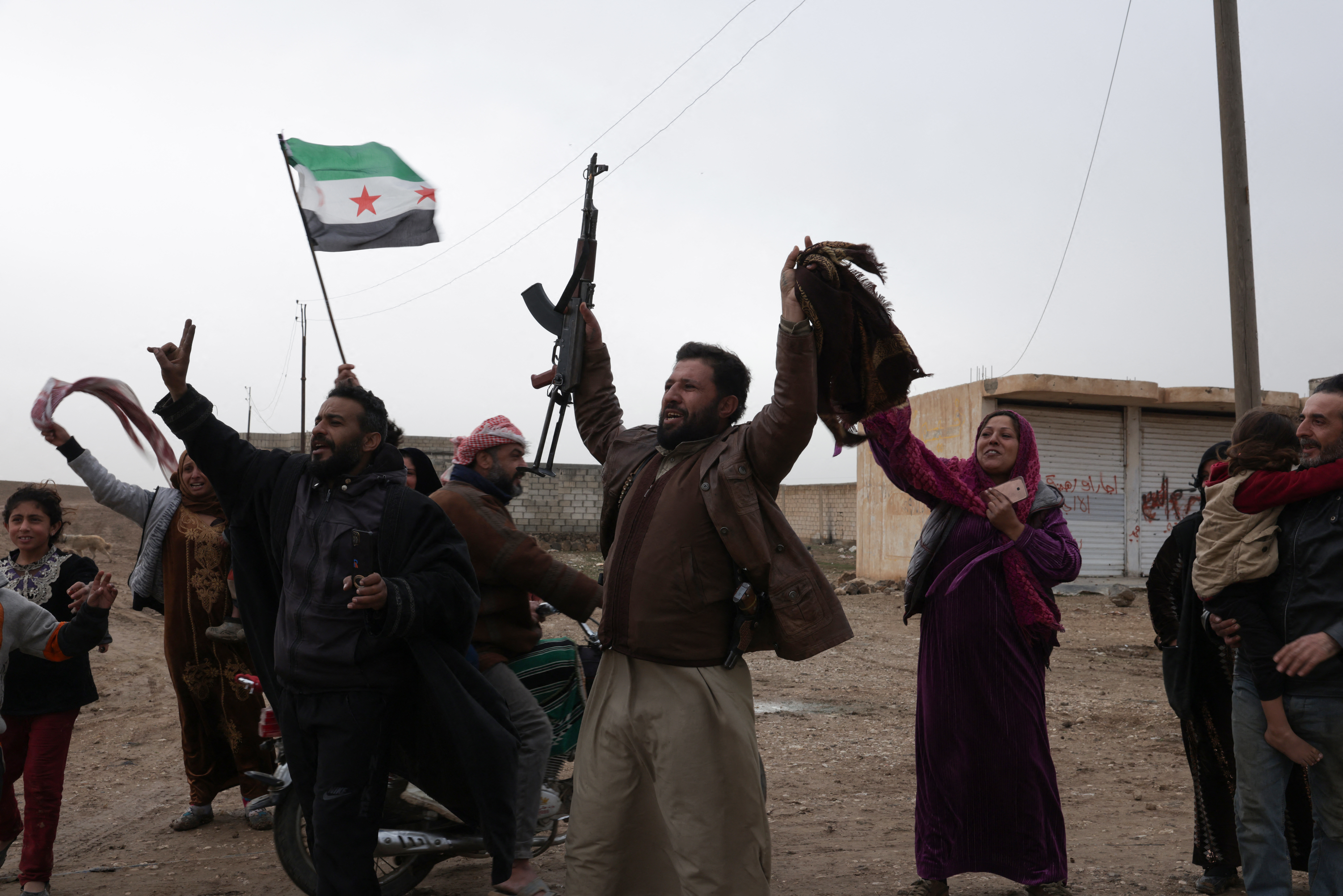 Residents cheer as Syrian government internal security forces enter the northeastern Syrian city of Hasakeh on February 2, 2026.