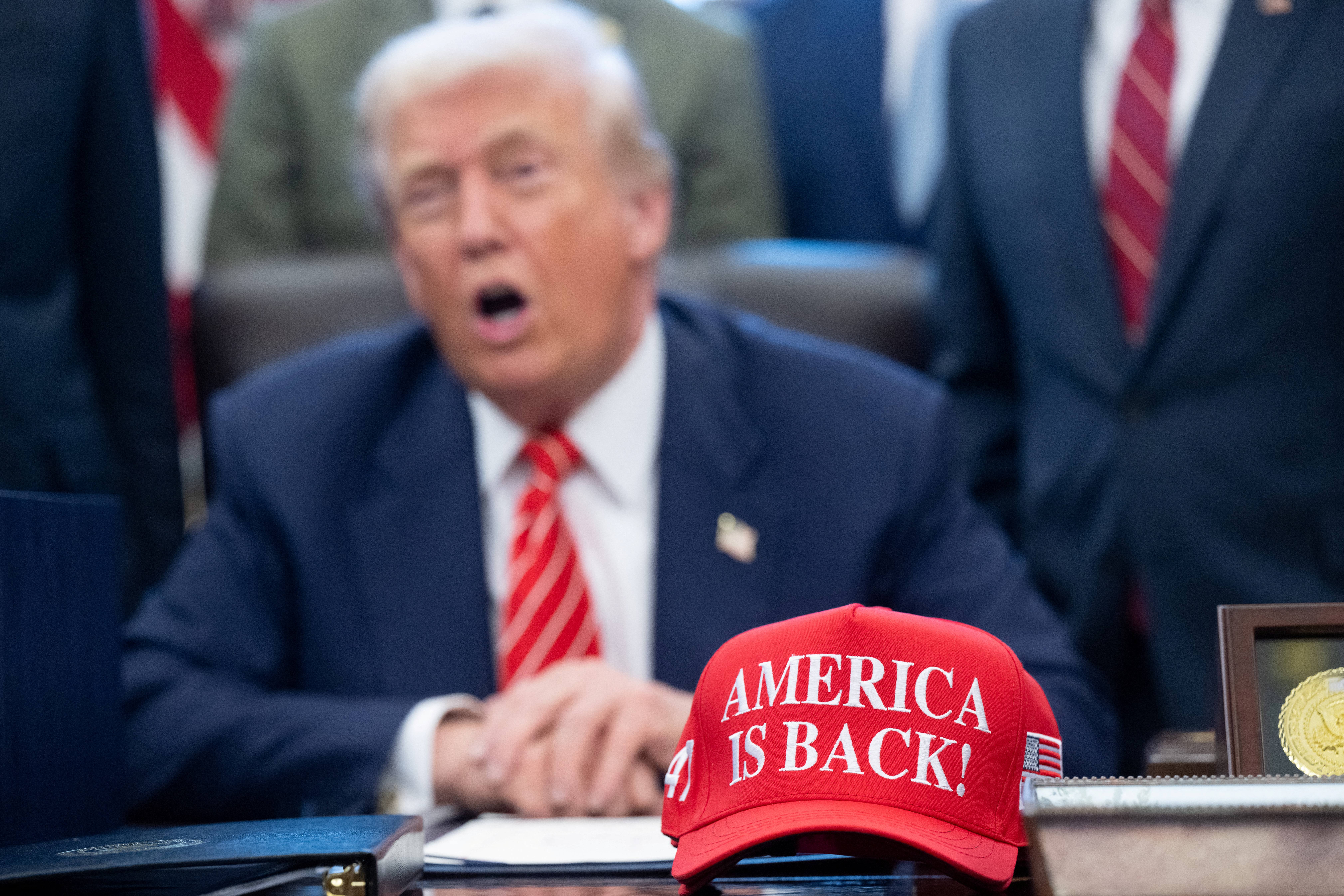 US President Donald Trump speaks with the media after signing a funding bill to end a partial government shutdown in the Oval Office of the White House in Washington, DC, February 3, 2026.