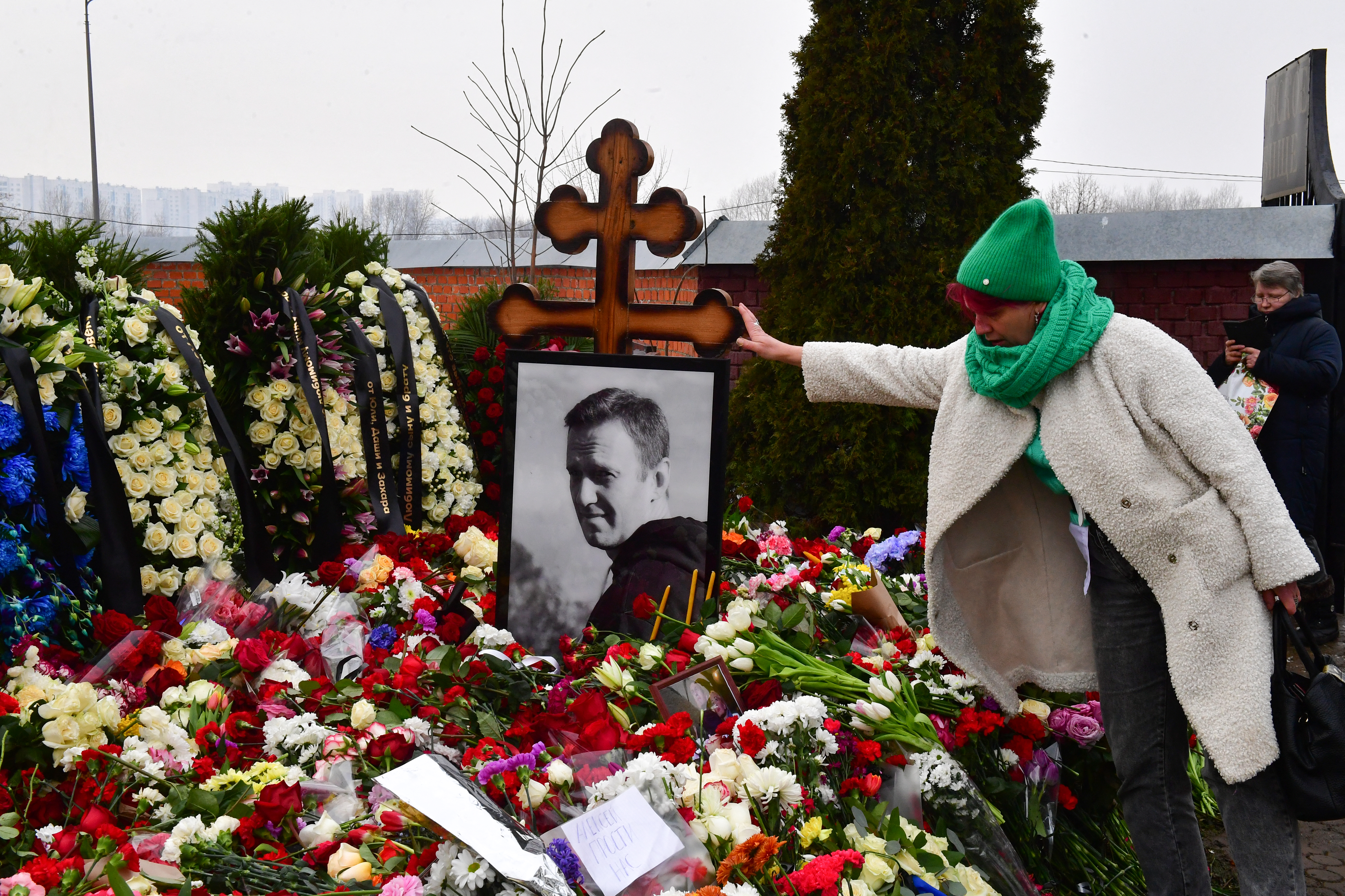 A mourner visits the grave of Russian opposition leader Alexey Navalny at the Borisovo cemetery in Moscow in March 2024