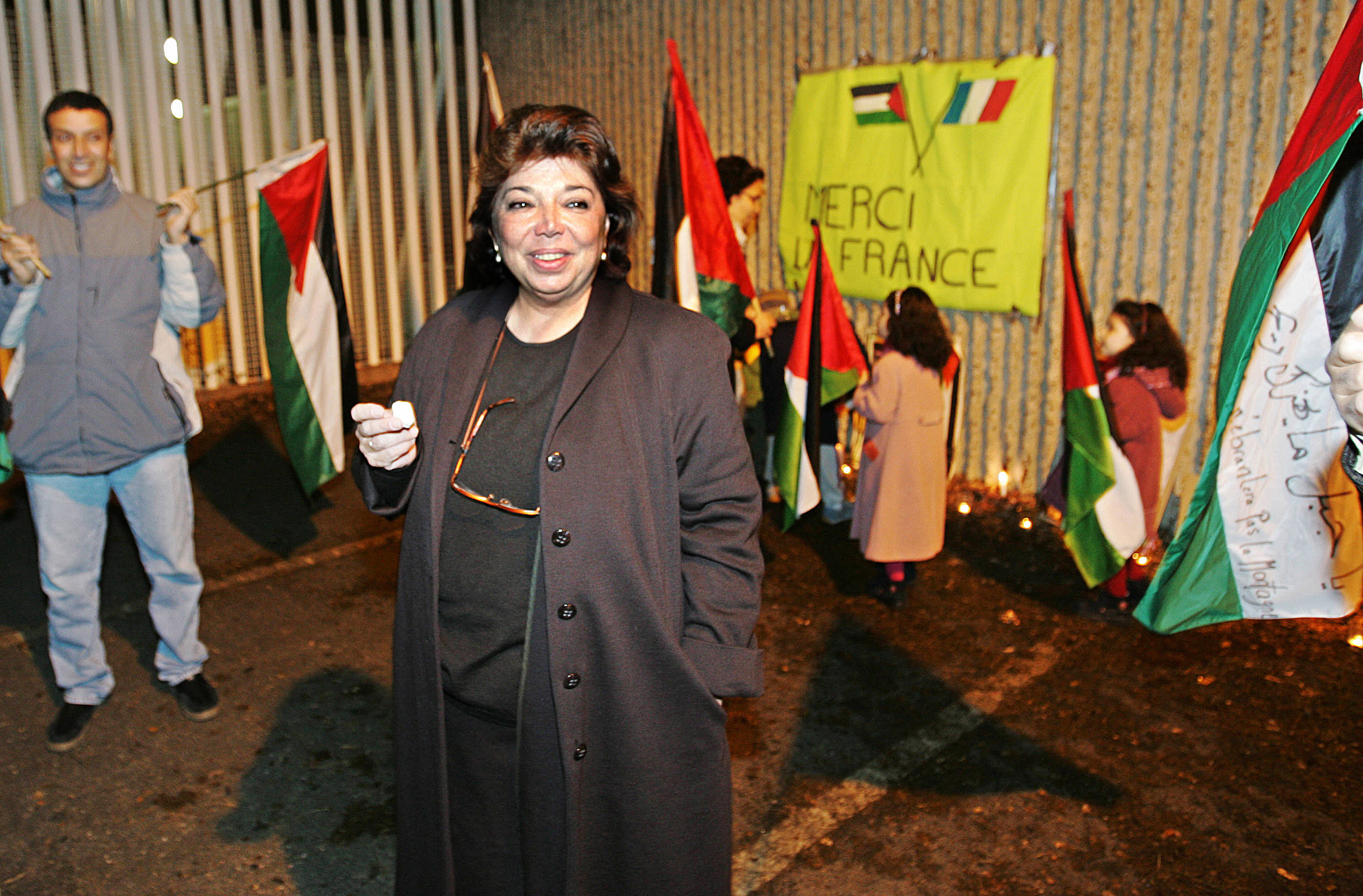 (FILES) Palestinian representative in France Leila Shahid meets people gathered in front of the Percy military hospital in the southwestern Paris suburb of Clamart in support of Palestinian authority leader Yasser Arafat who is being treated, on November 2, 2004.
