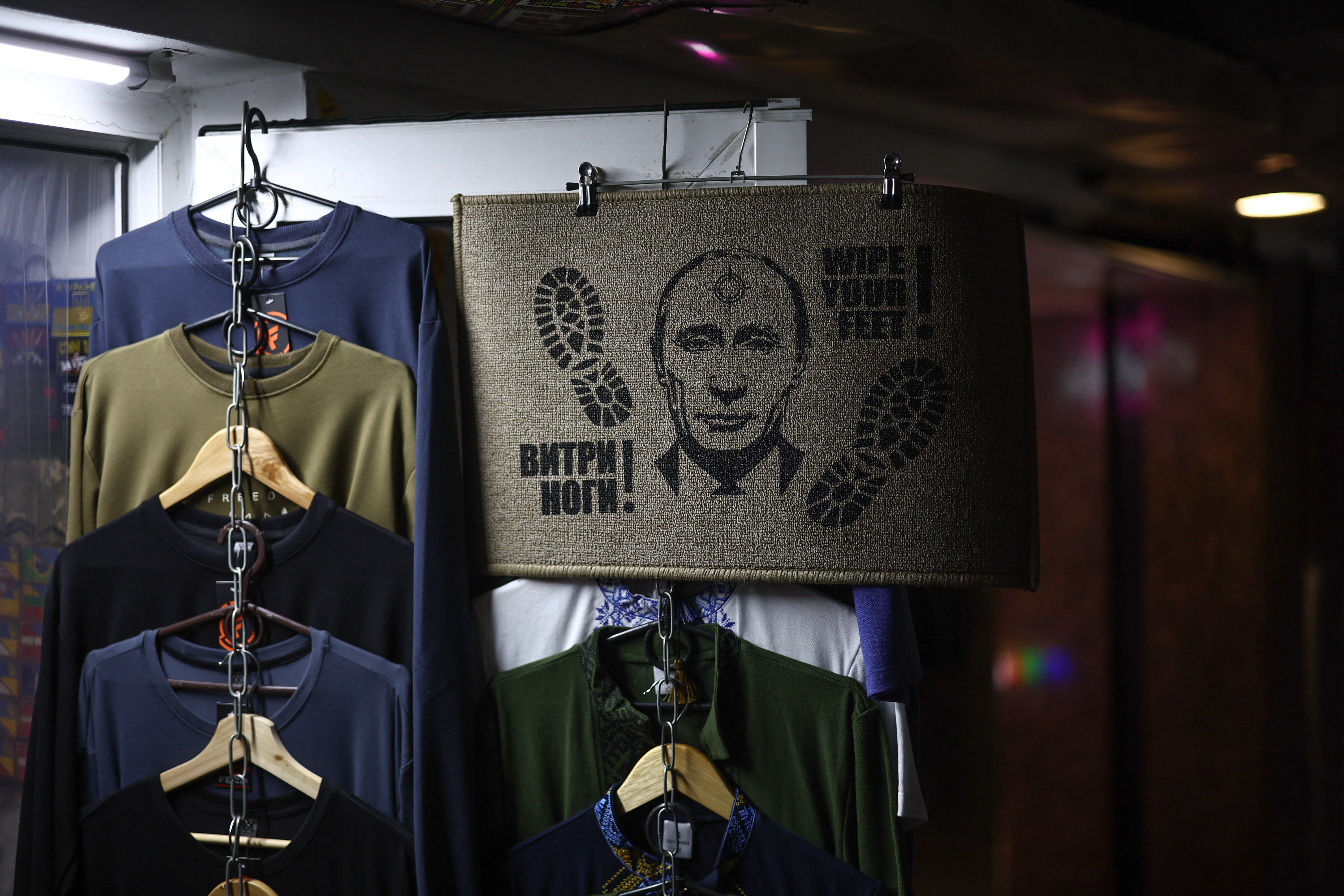 A door mat featuring a depiction of Russian President Vladimir Putin is seen outside a shop in Independence Square in Kyiv on February 23, 2026, as the conflict with Russia reaches its four-year mark.