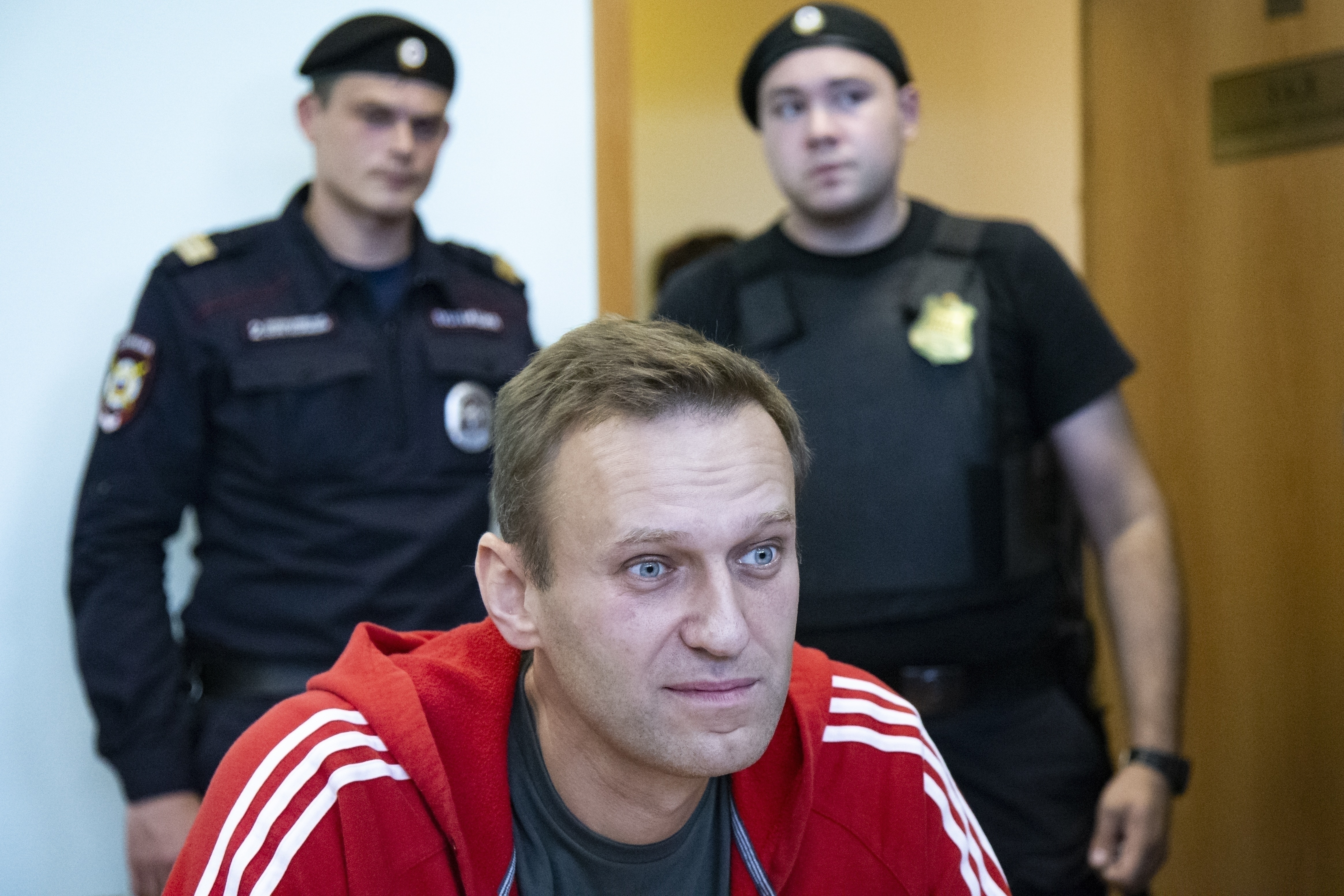 FILE - In this Aug. 22, 2019, file photo, Russian opposition leader Alexei Navalny speaks to the media prior to a court session in Moscow, Russia. (AP Photo/Alexander Zemlianichenko, File)