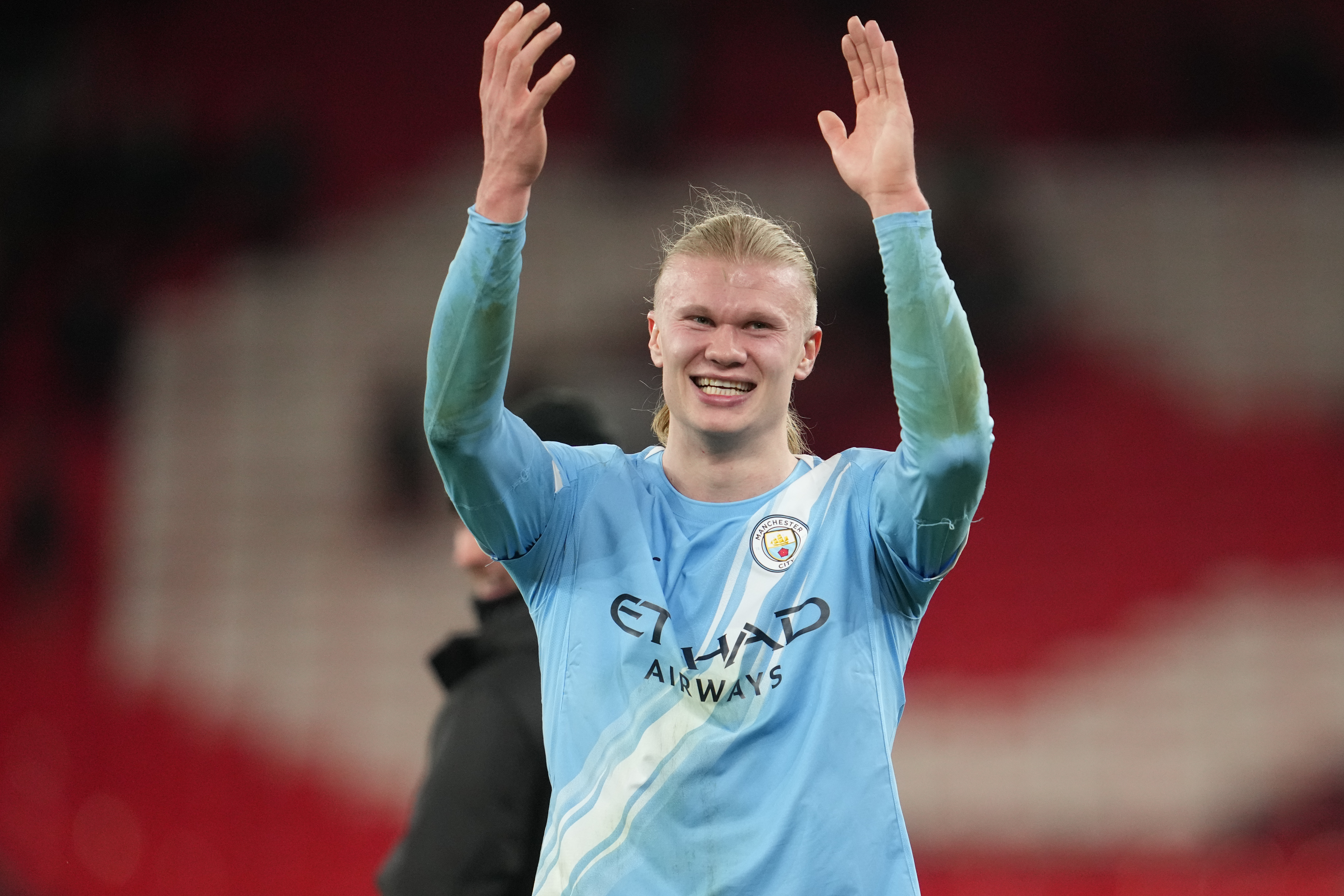 Manchester City's Erling Haaland applauds the fans.
