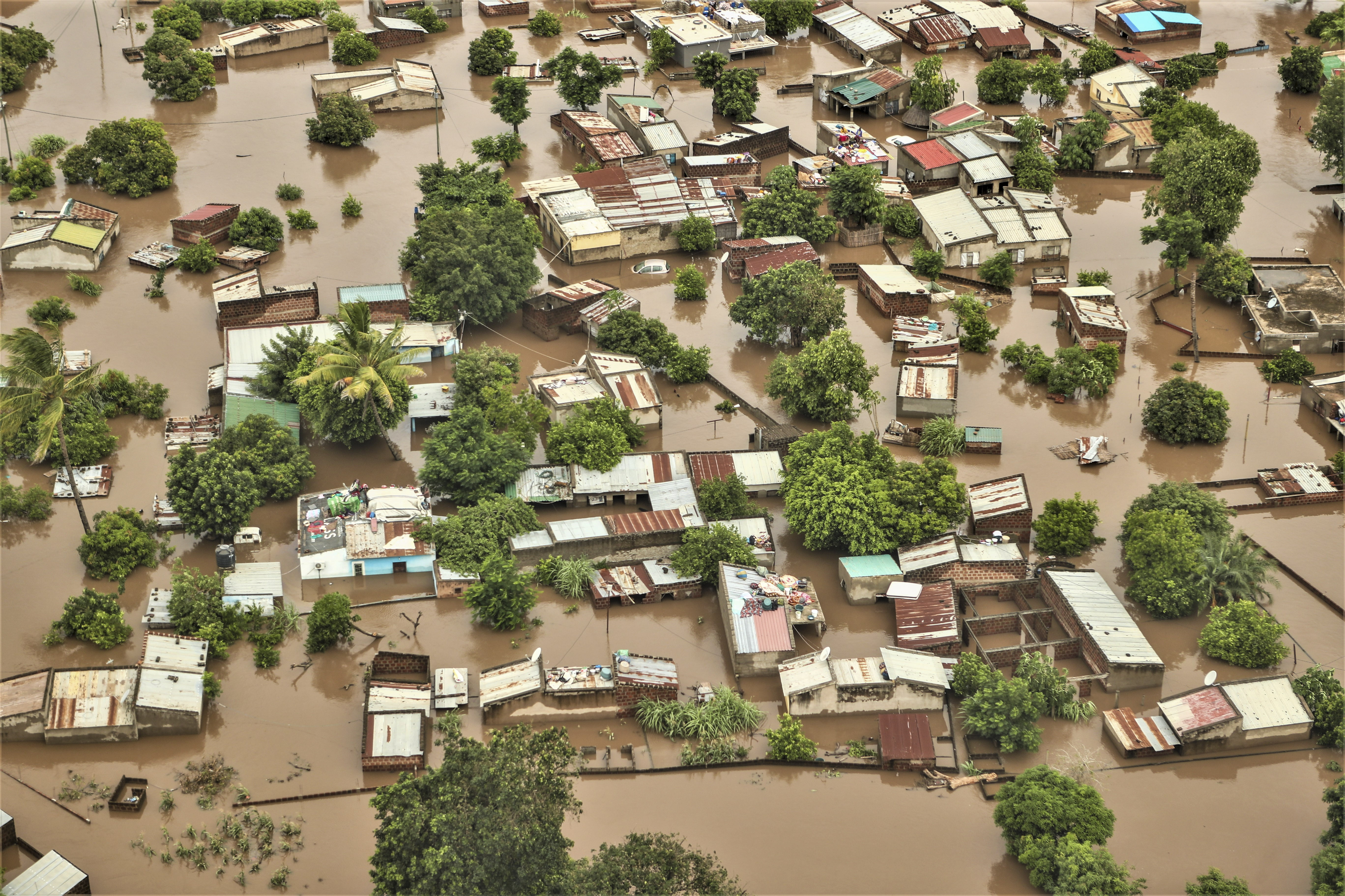 epa12664695 An aerial view shows the flooded 03 February neighbourhood between the Maputo and Gaza regions, Maputo, Mozambique, 20 January 2026. Rescue efforts continue for hundreds of families cut off by flooding, with some taking refuge on rooftops, car roofs, or in treetops in southern Mozambique after days of near-continuous rain that has also forced dams, including some in neighbouring countries, to increase water releases. EPA/LUISA NHANTUMBO