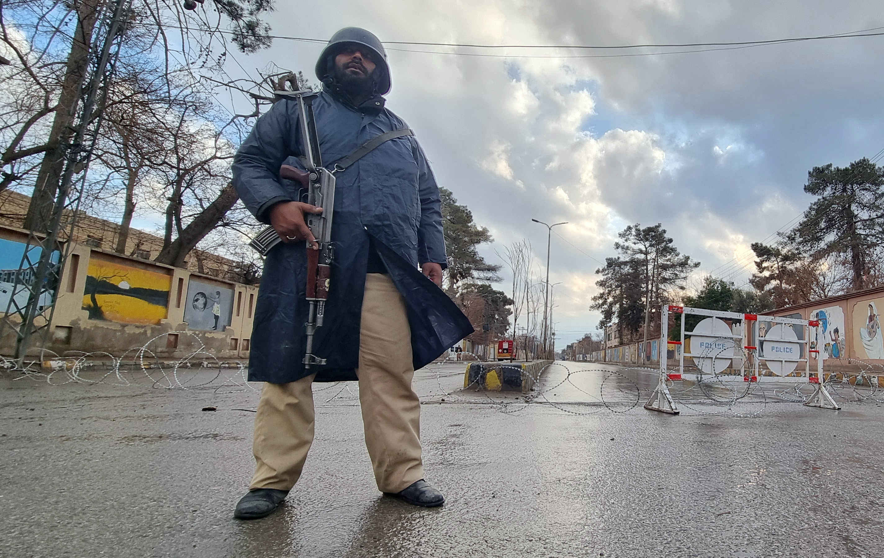Security personnel stand guard on a road in Quetta, Pakistan