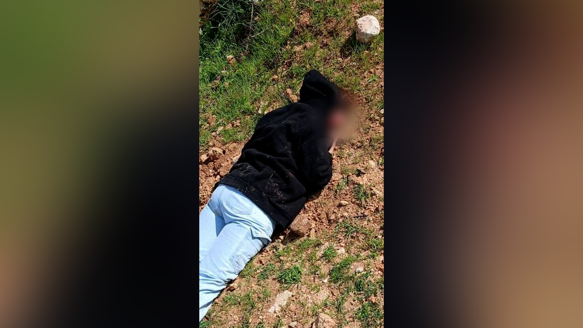 A woman identified as a 71-year-old foreign solidarity activist lies on the ground after being attacked by Israeli settlers