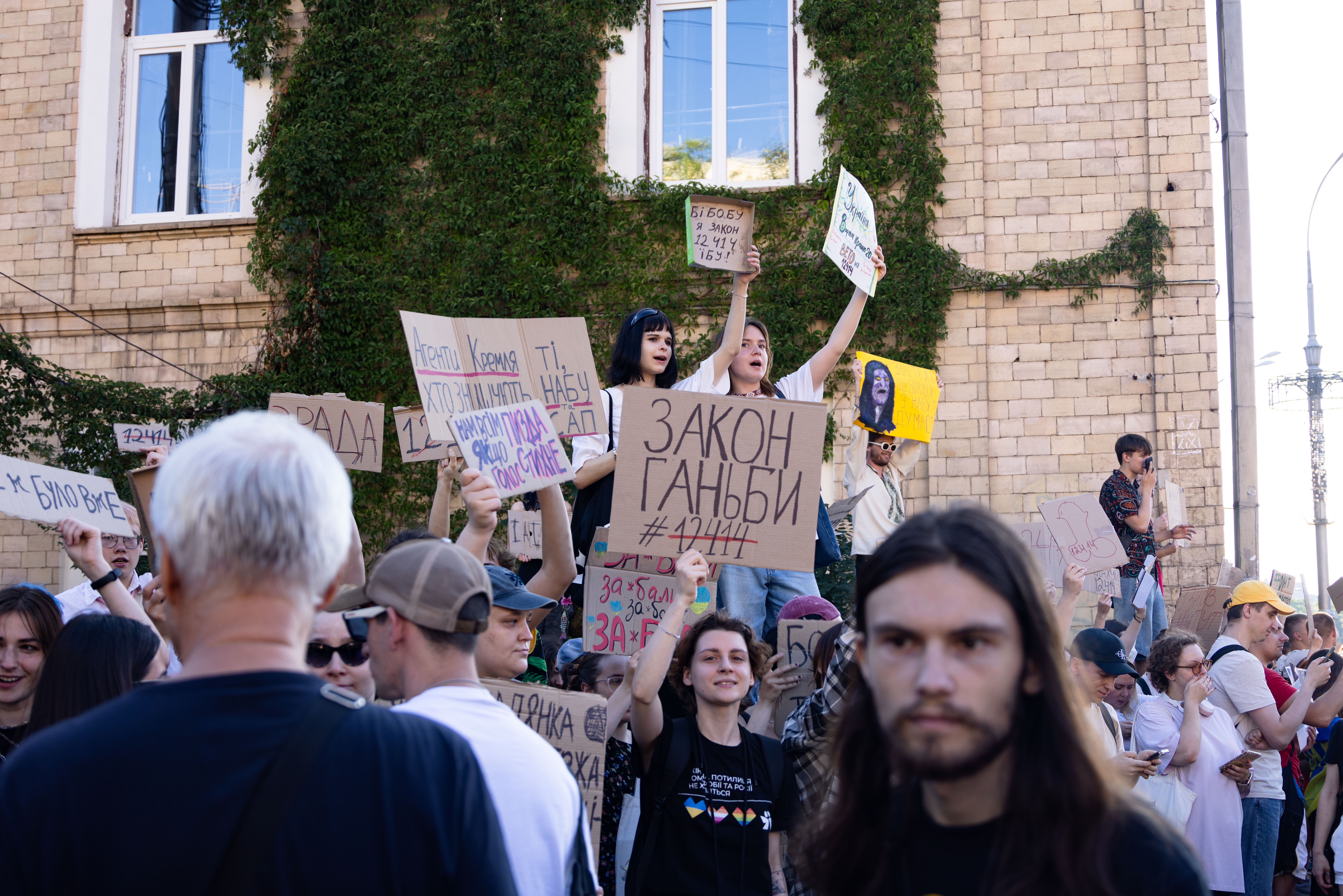 KHARKIV, UKRAINE - JULY 23: Thousands of residents of Kharkiv are seen on Main Street during a protest against a new bill curtailing anti-corruption agencies on July 23, 2025 in Kharkiv, Ukraine. The Ukrainian parliament recently passed a law endowing a president-appointed prosecutor general with control over the investigations and cases handled by the National Anti-Corruption Bureau of Ukraine (NABU) and the Specialized Anti-Corruption Prosecutor's Office (SAPO). The protests, which accuse the government of undermining anti-corruption efforts in the country, are the first significant protests against President Volodymyr Zelensky since Ukraine was invaded by Russia in February 2022. (Photo by Nikoletta Stoyanova/Getty Images)