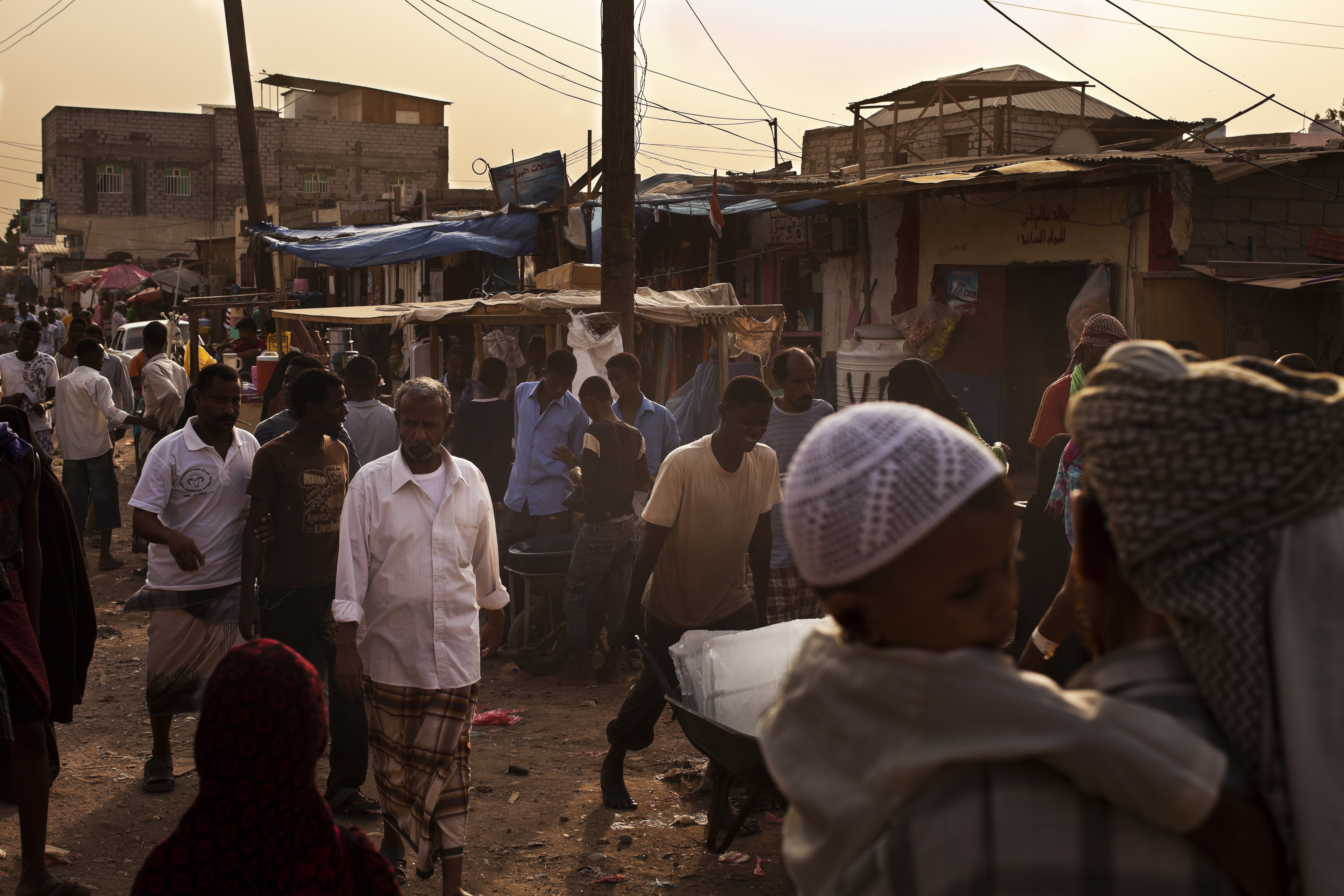 ADEN, YEMEN - AUGUST 2010: Busy market scenes in the Al-Basateen urban refugee area, Aden, Yemen, August 11, 2010. Many of these people are part of a huge number of people making the 200-mile voyage across the Gulf of Aden each year from the failed state of Somalia. There are currently about 230,000 Somalis living and working in Yemen. The Al-Basateen urban refugee area is a transit point. It houses 15,000 to 20,000 people. In 2009, about 80,000 refugees arrived in Yemen mainly from Somalia. (Photo by Brent Stirton/Reportage by Getty Images)