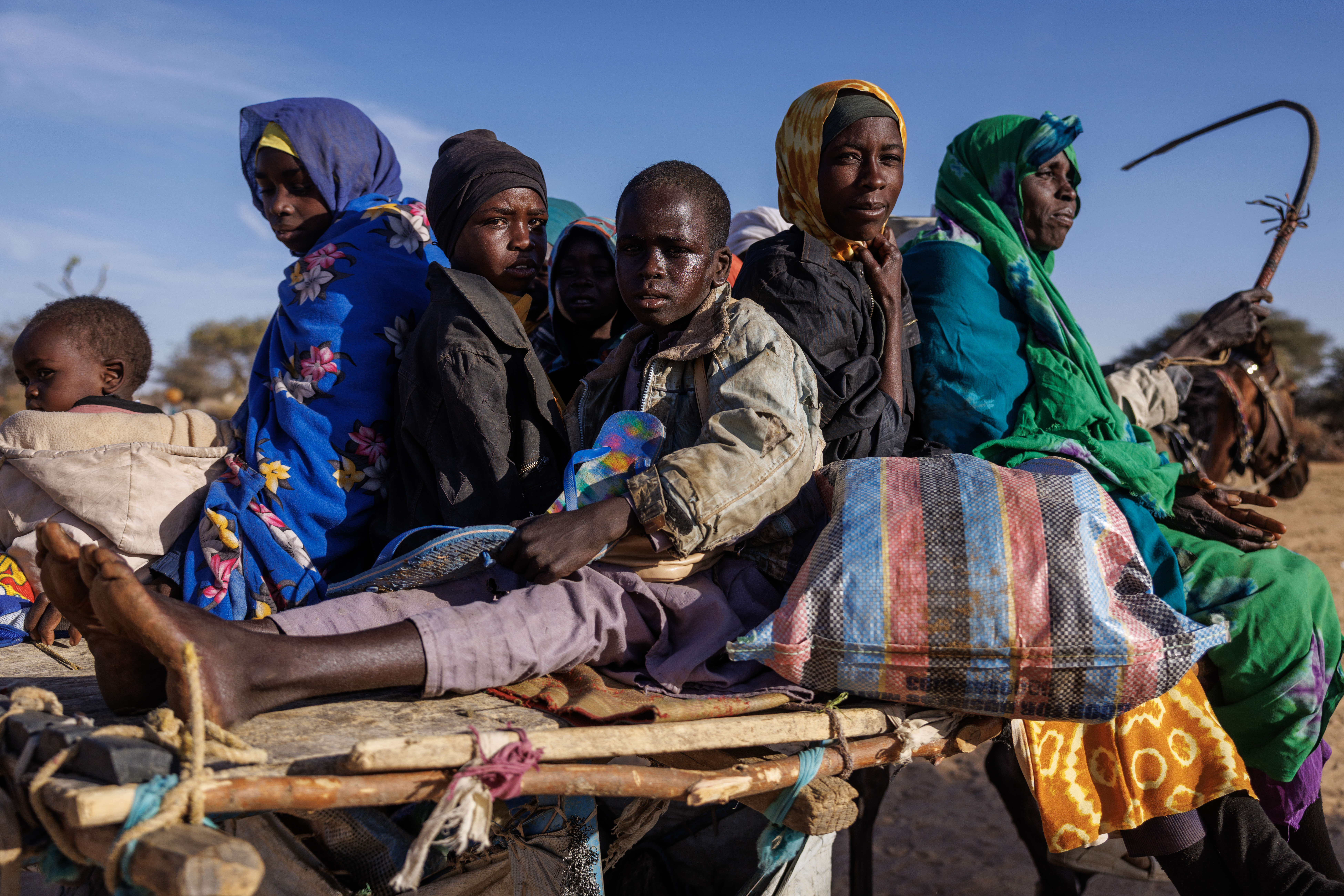 Sudanese refugees ride through the Oure Cassoni refugee camp, Chad, on February 24, 2026 [Dan Kitwood/Getty Images]