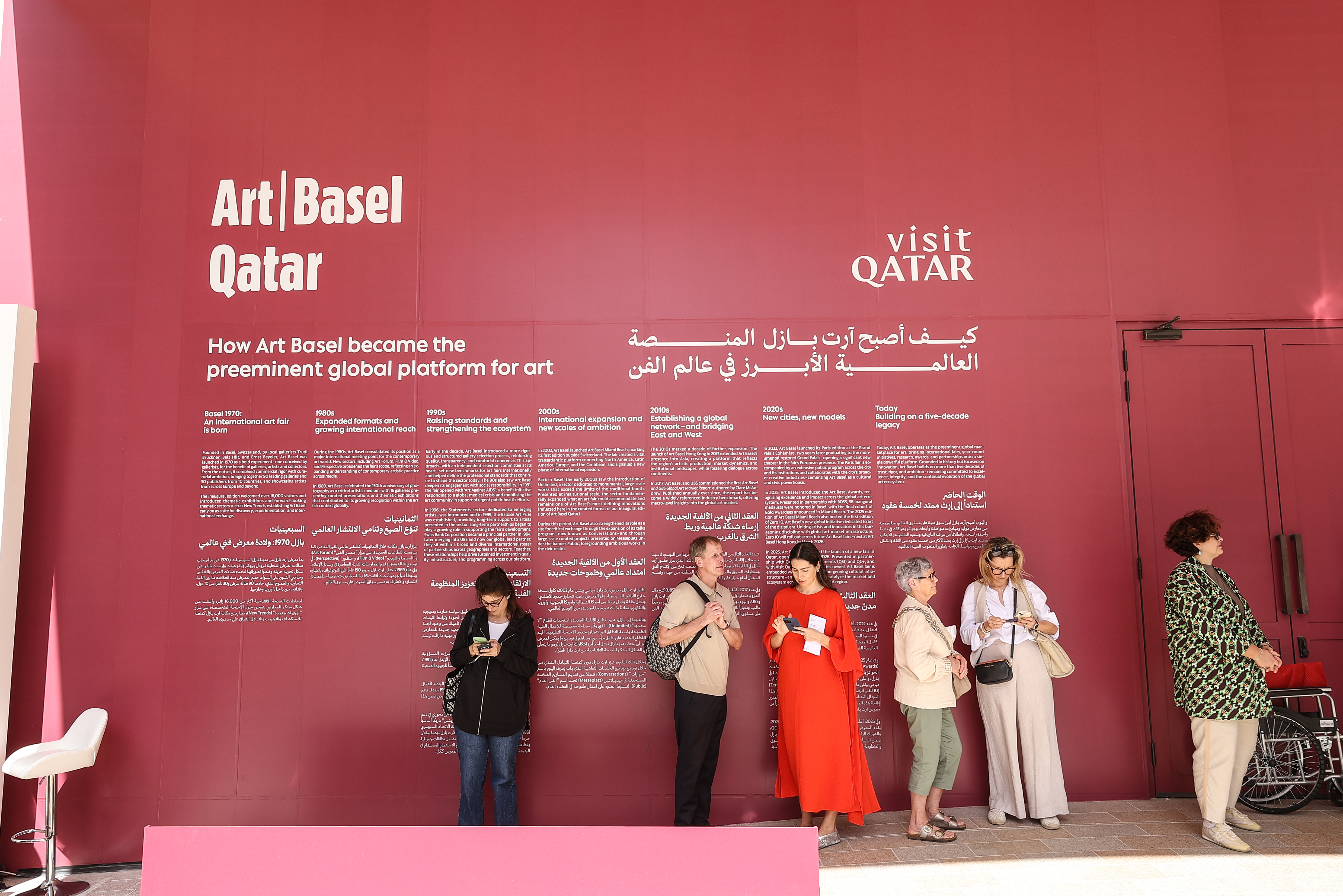Visitors explore artworks and installations at the Art Basel Qatar Edition in Doha