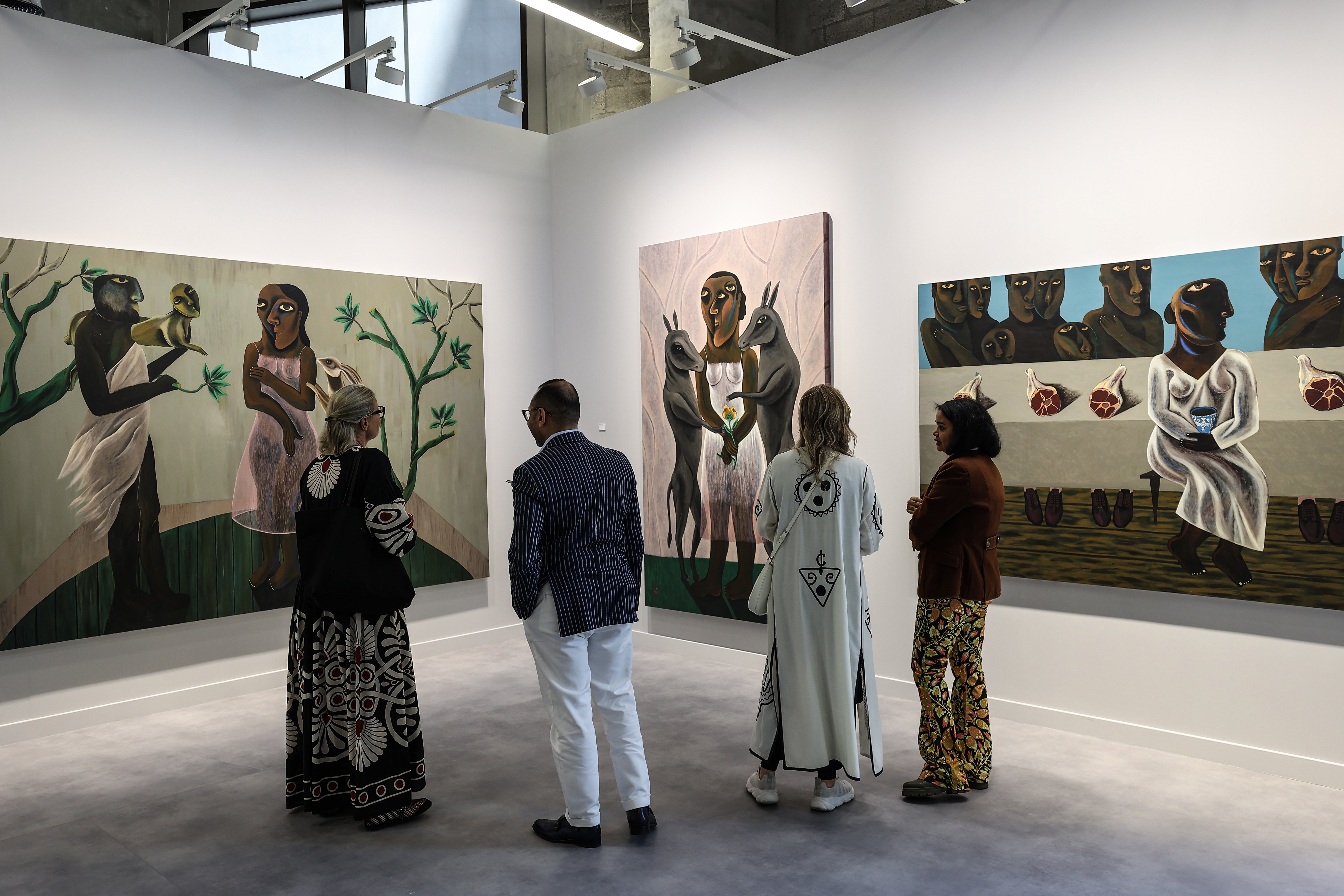 Visitors explore artworks and installations at the Art Basel Qatar Edition in Doha