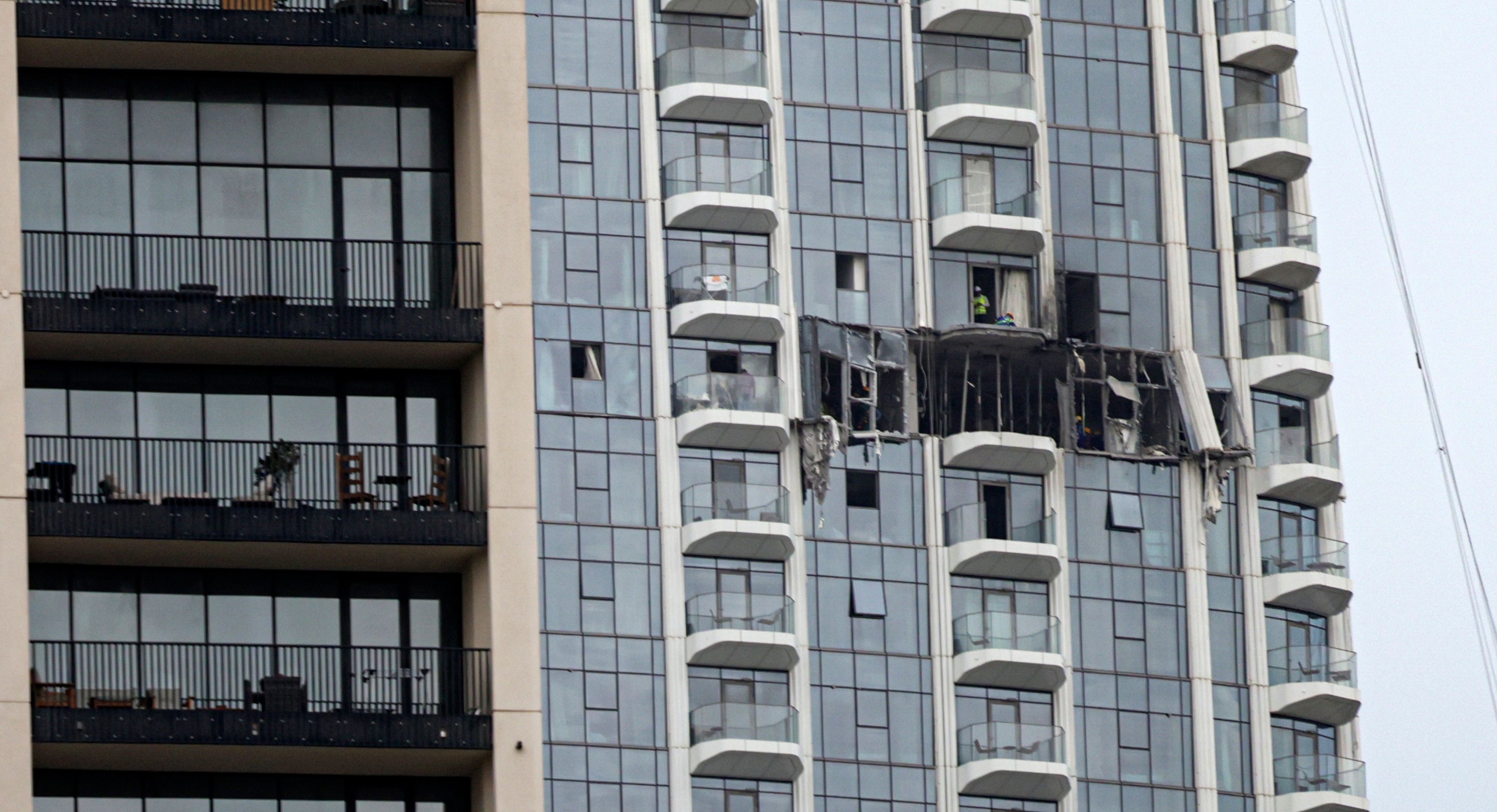 A view of the damaged part of the Dubai Creek Harbour Tower after it was hit by an Iranian drone attack in Dubai,