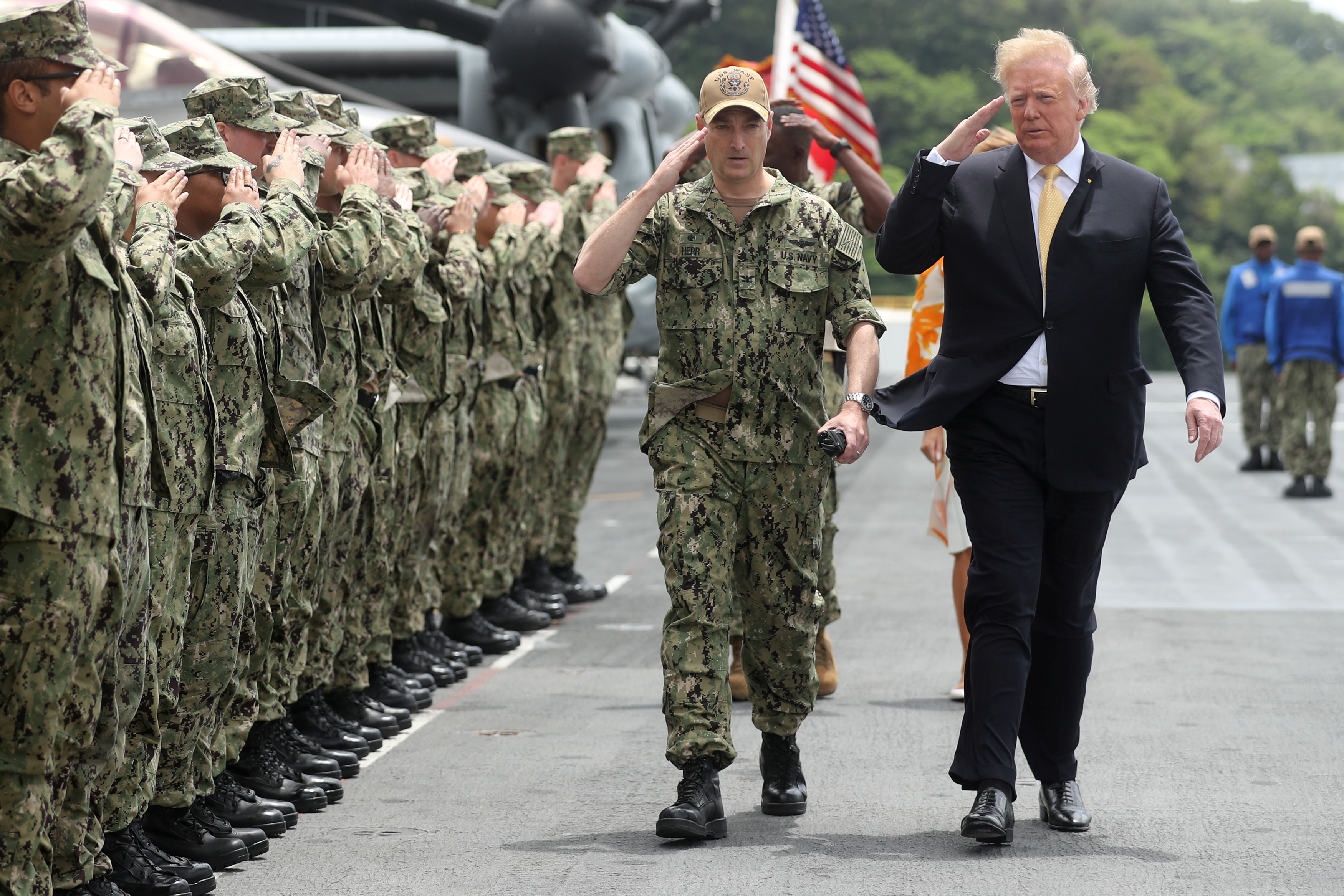 U.S. President Donald Trump salutes troops aboard the USS Wasp (LHD 1) in Yokosuka, south of Tokyo, Japan May 28, 2019. REUTERS/Jonathan Ernst