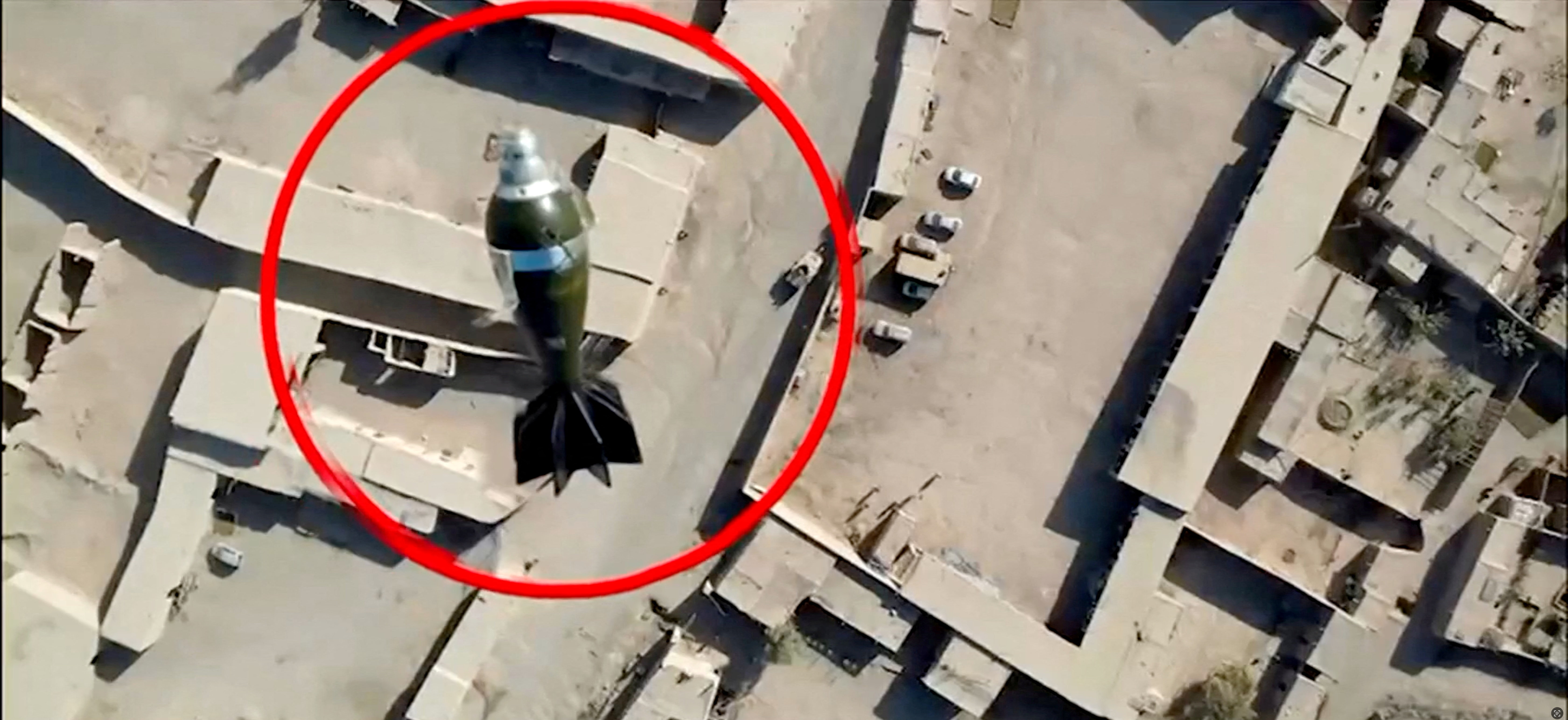 A mortar round falls towards a target from a drone, in this still image from handout video, said to show Pakistani forces conducting a strike on an Afghan Taliban border post, in Spin Boldak, Afghanistan, October 15, 2025. [ISPR/Handout/Reuters]