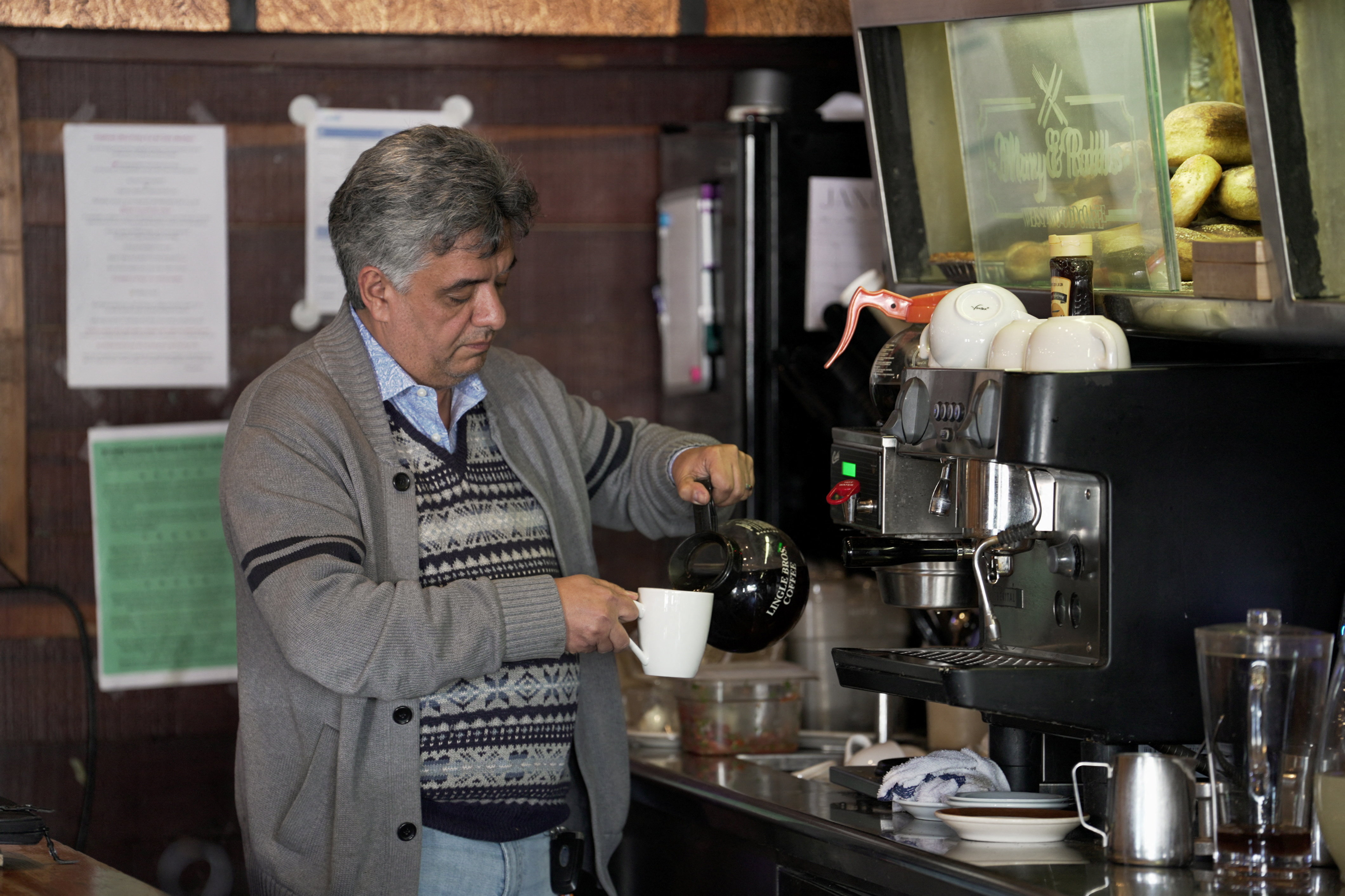 Roozbeh Farahanipour, an Iranian-American activist, prepares coffee inside his restaurant, Mary &amp; Robbs Westwood Cafe, in Los Angeles, California, U.S., January 12, 2026. REUTERS/Arafat Barbakh