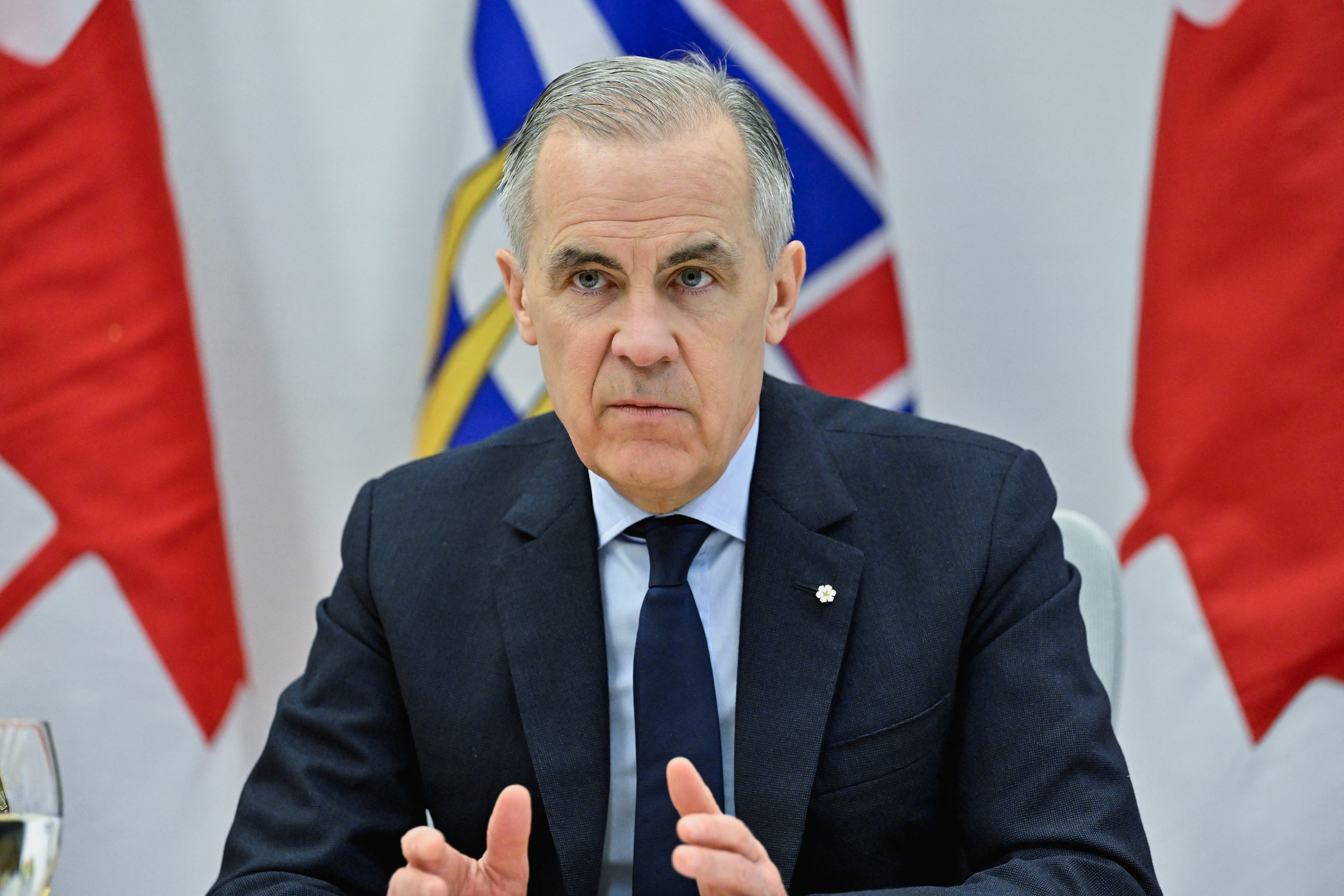Canada's Prime Minister Mark Carney meets with local municipal police chiefs, the RCMP, CBSA, and local caucus members at the RCMP E-Division headquarters in Surrey, British Columbia, Canada, February 19, 2026. REUTERS/Jennifer Gauthier