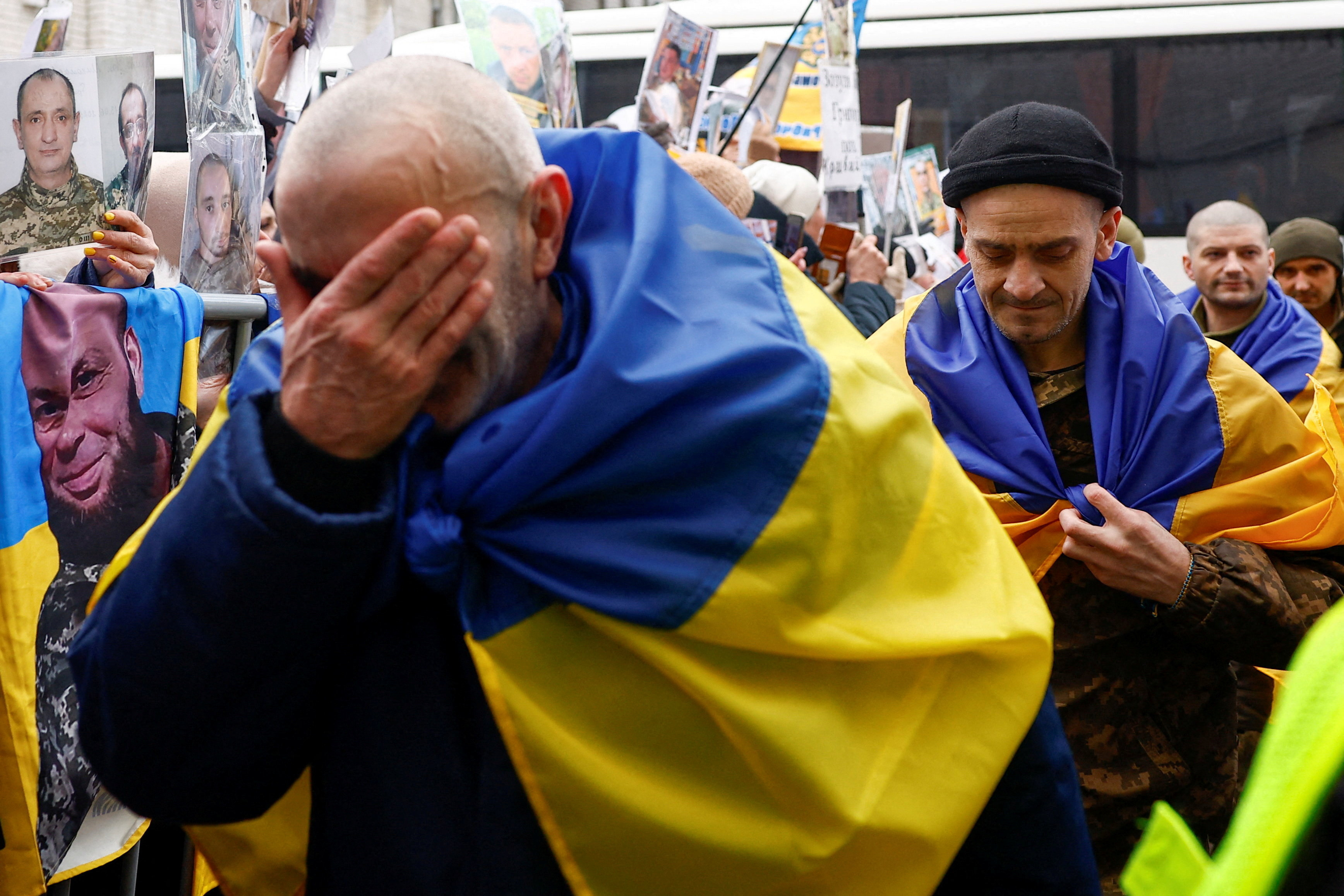 Freed Ukrainian prisoners of war (POWs) react while they leave a bus after a swap, amid Russia's attack on Ukraine, in an undisclosed location in Ukraine, in an undisclosed location, in Ukraine March 5, 2026. REUTERS/Valentyn Ogirenko TPX IMAGES OF THE DAY
